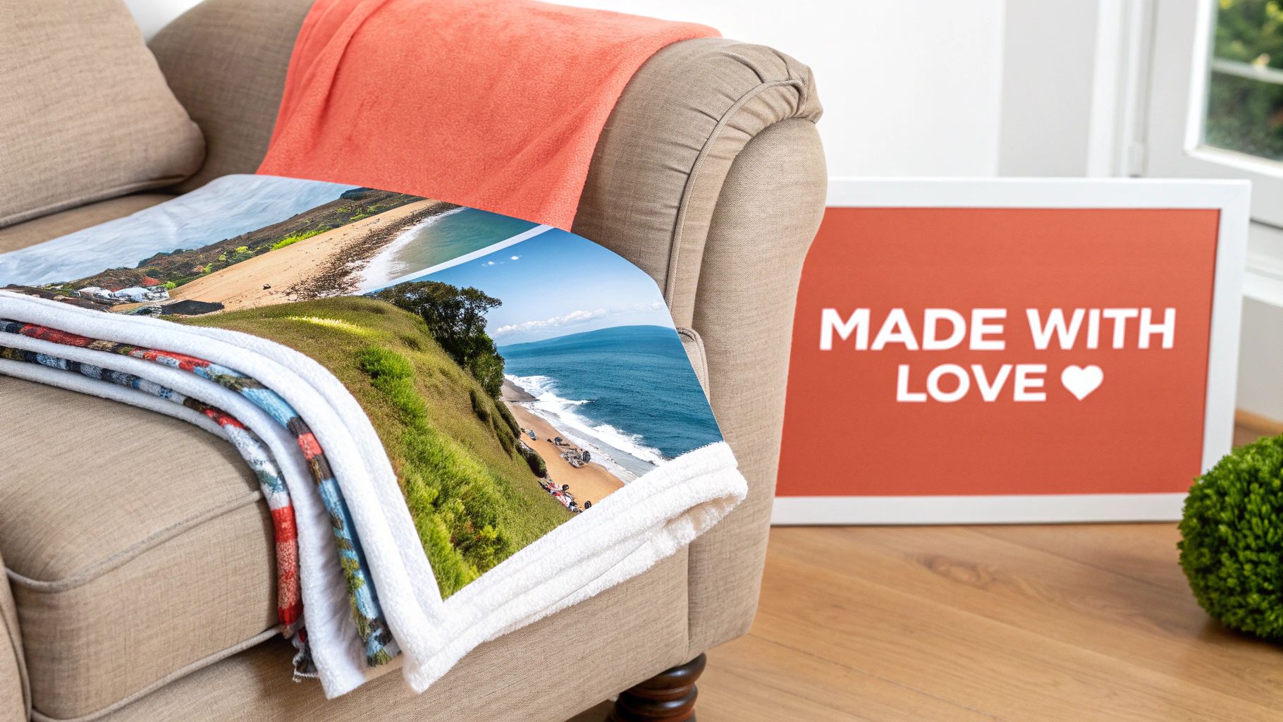 A custom photo blanket featuring a coastal landscape draped on a comfy armchair with a 'MADE WITH LOVE' sign.