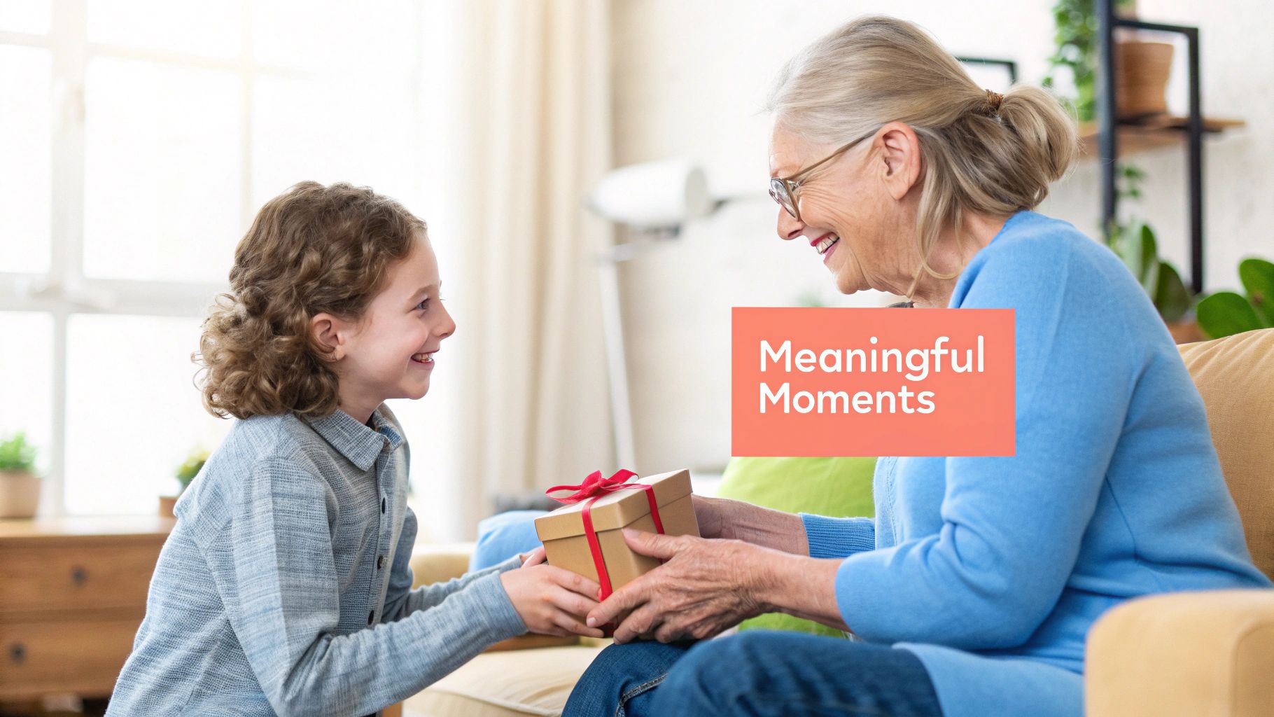 A smiling child with curly hair gives a wrapped gift to a smiling older woman with glasses.