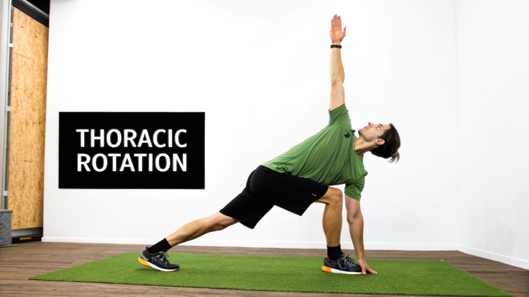 A man performs a thoracic rotation exercise on a green mat, stretching his torso upwards.