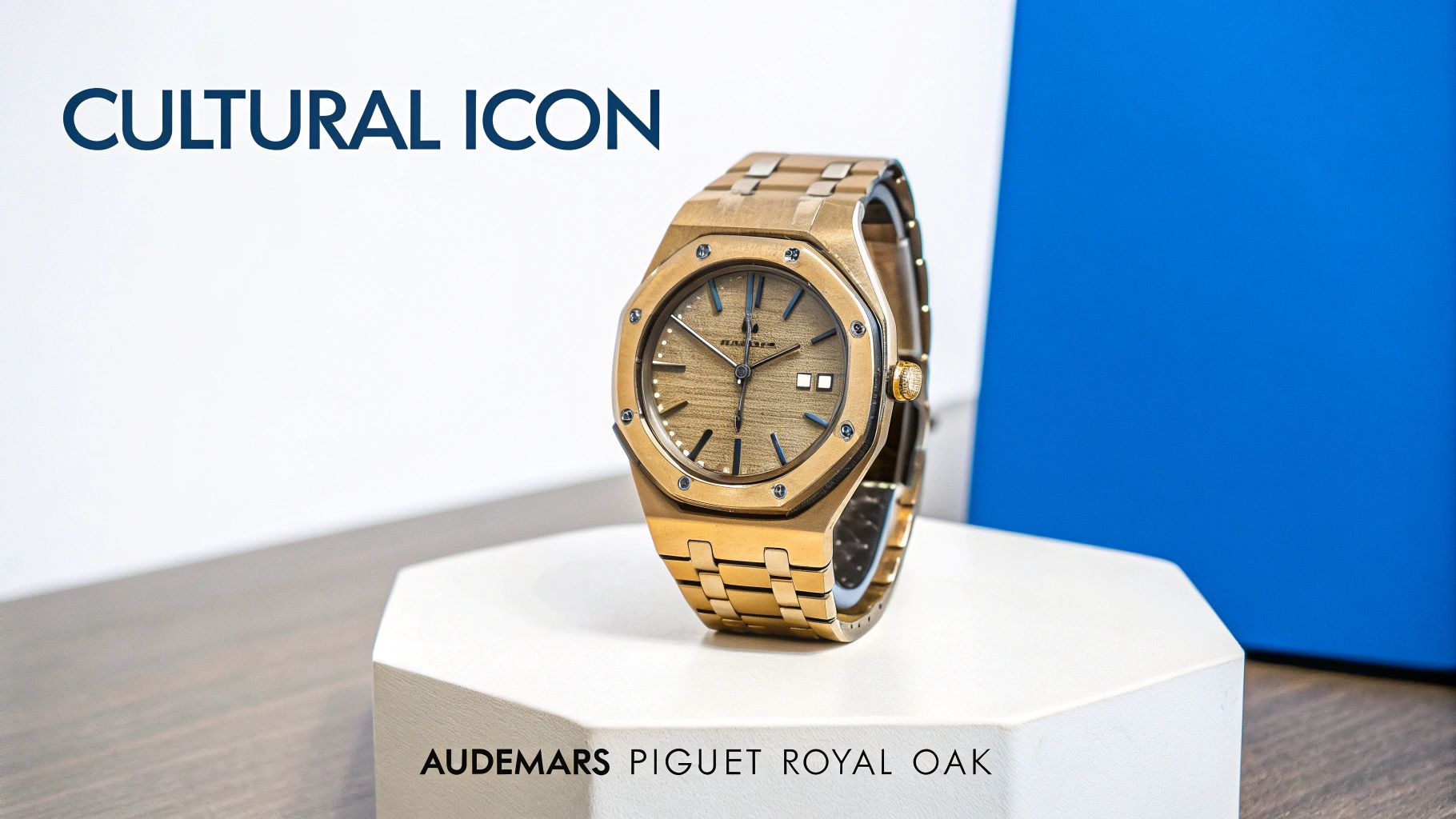 A luxurious gold Audemars Piguet Royal Oak watch, a cultural icon, displayed on a white stand.