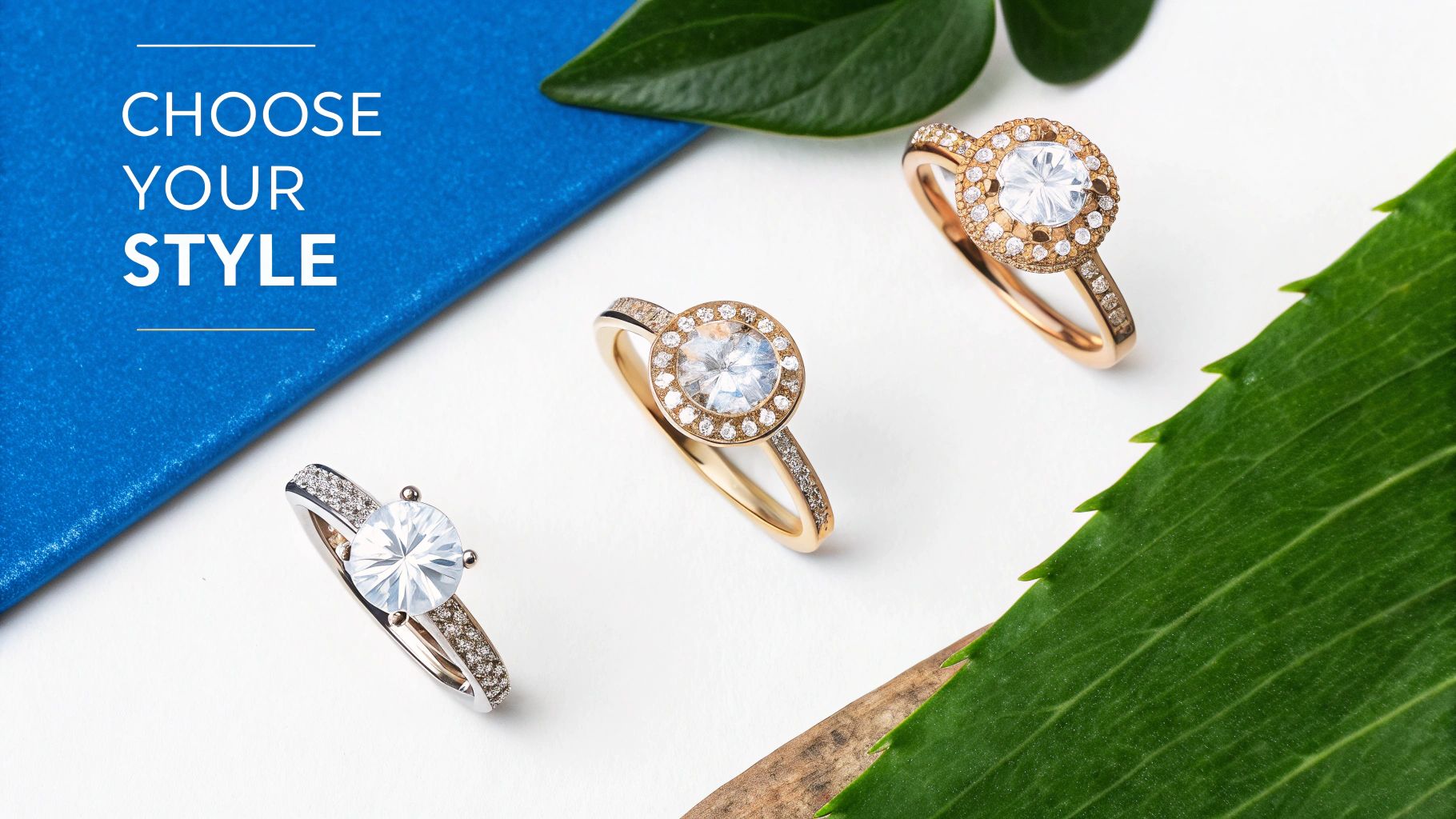 A collection of three stylish diamond rings, including halo and solitaire designs, on a white background with greenery.