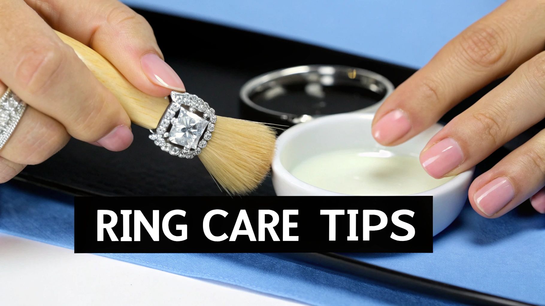 A hand using a small brush to clean a halo diamond engagement ring, dipping it into a cleaning solution.