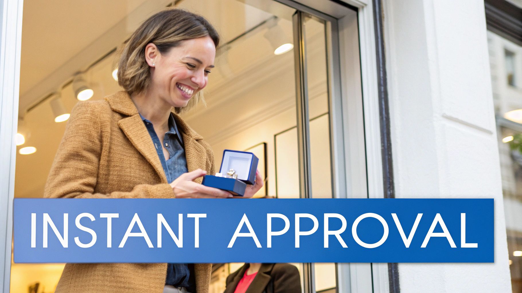 A smiling person happily trying on a new luxury watch at a jewelry store counter.