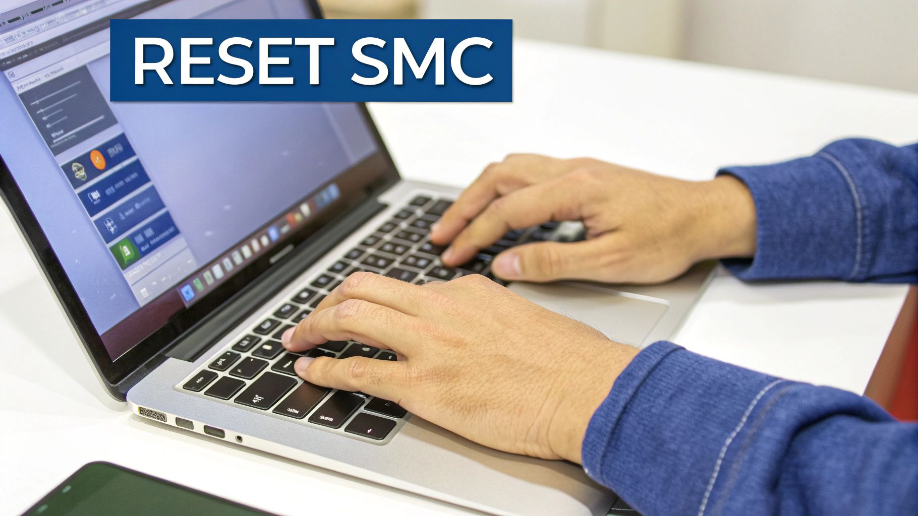 Hands typing on a silver MacBook Pro laptop keyboard with 'RESET SMC' overlay.