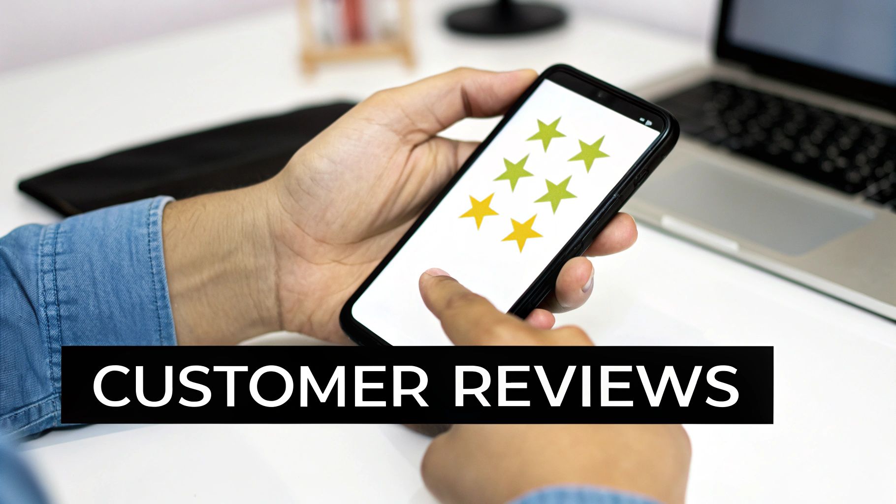 A person's hands hold a smartphone displaying customer star ratings, with 'CUSTOMER REVIEWS' text.