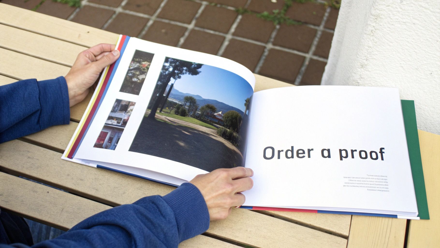 A person carefully inspecting the printed pages of a book proof
