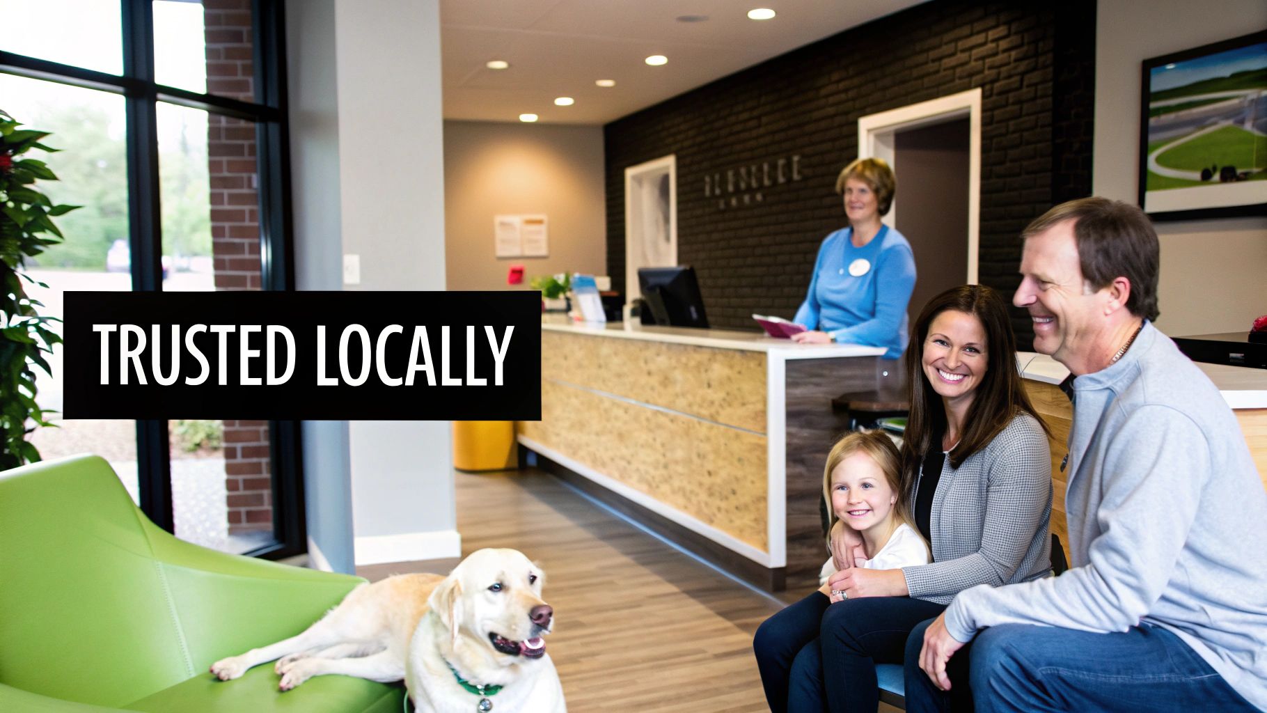 A smiling family with their dog in a modern dental office waiting room, with a receptionist.