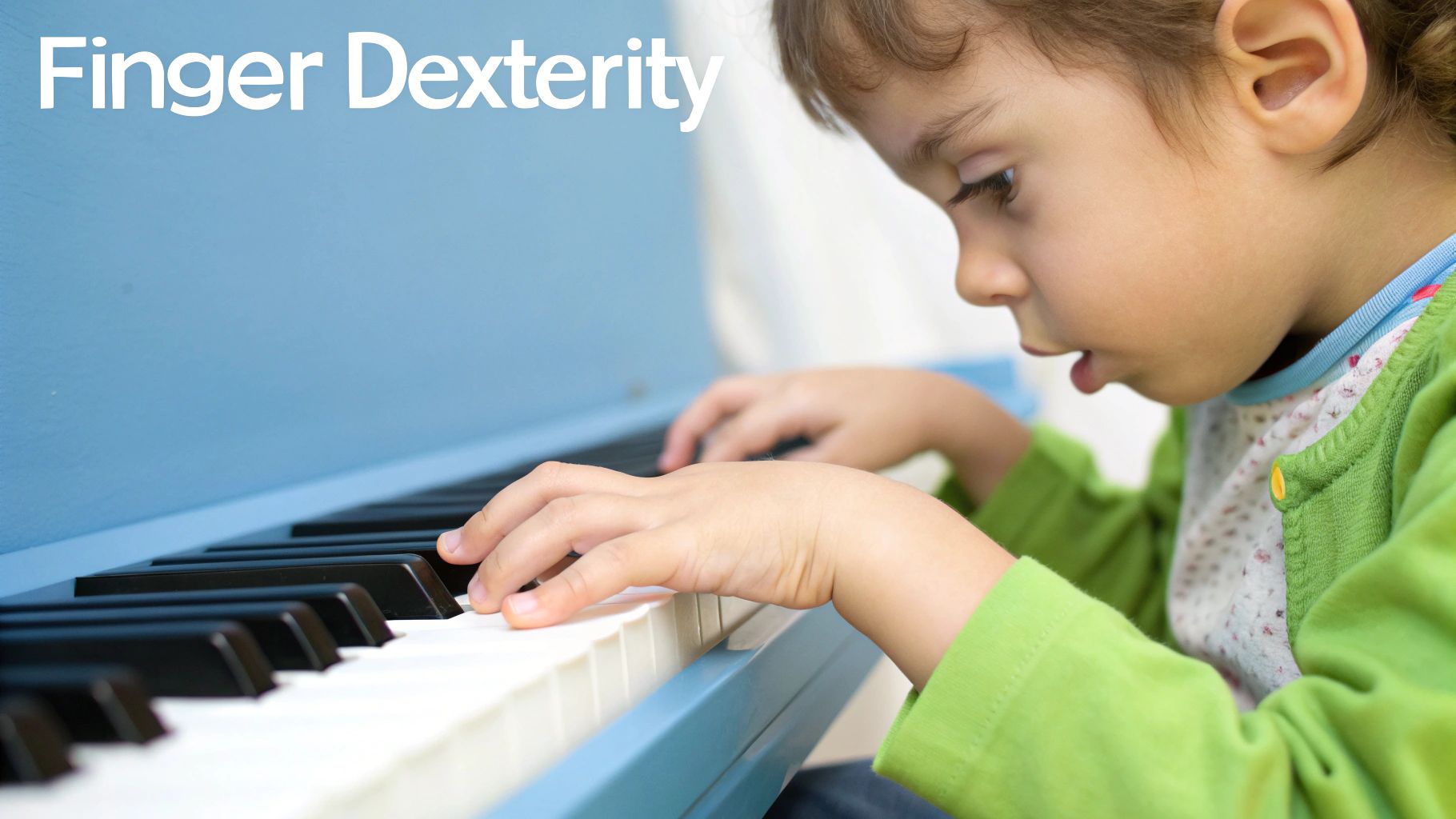 A young child focused on playing a blue piano, hands on the keys, demonstrating finger dexterity.