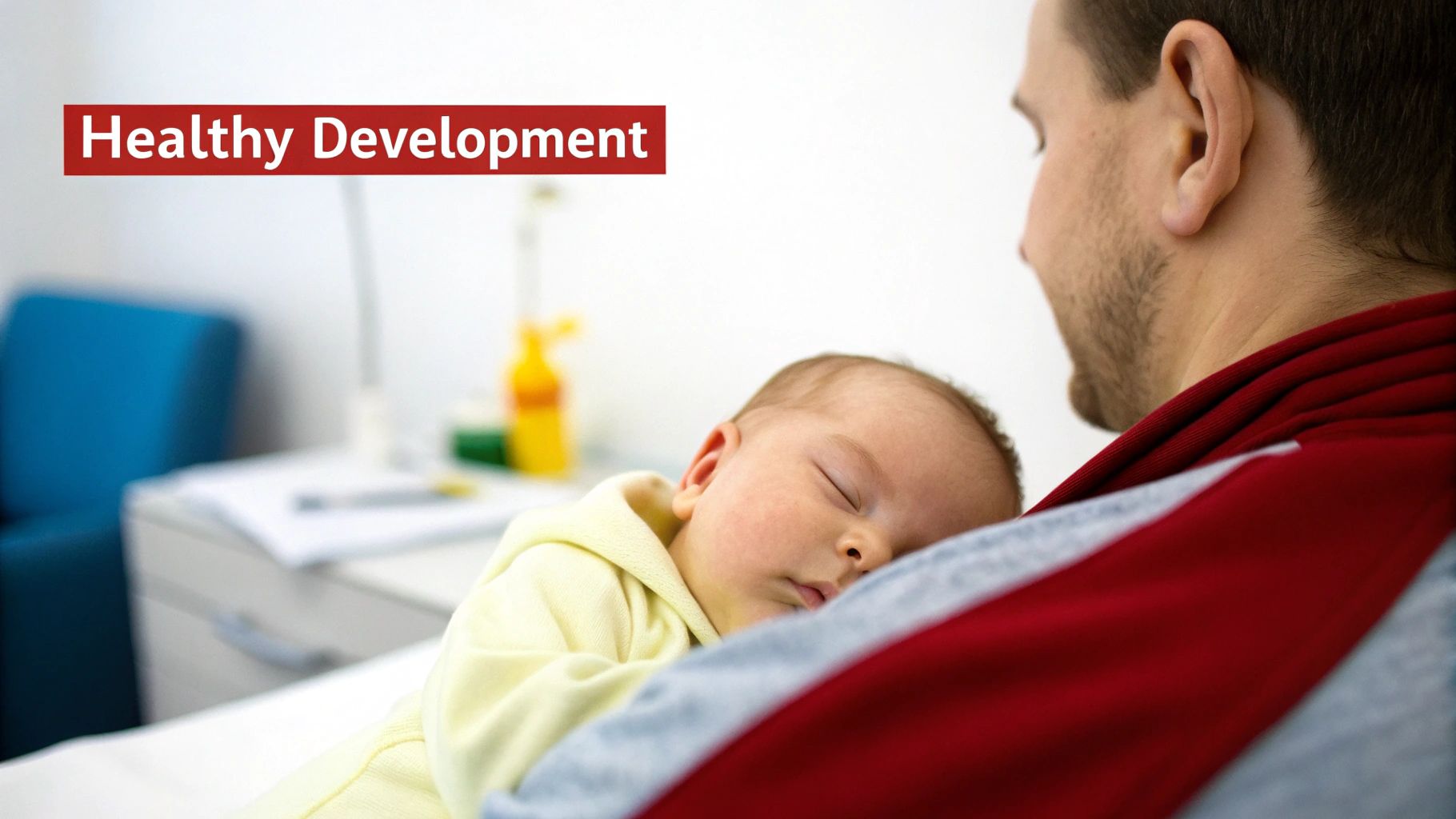A caring father gently holds his sleeping baby, symbolizing healthy development and well-being.