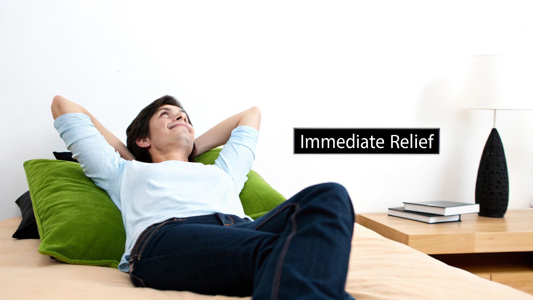 A man relaxing on a couch with green pillows, hands behind his head, looking content. Text: Immediate Relief.