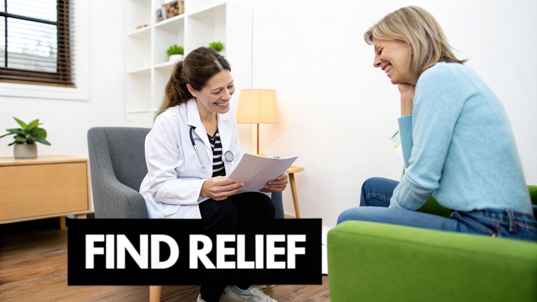 A smiling female doctor consults with a happy female patient, discussing papers in an office.