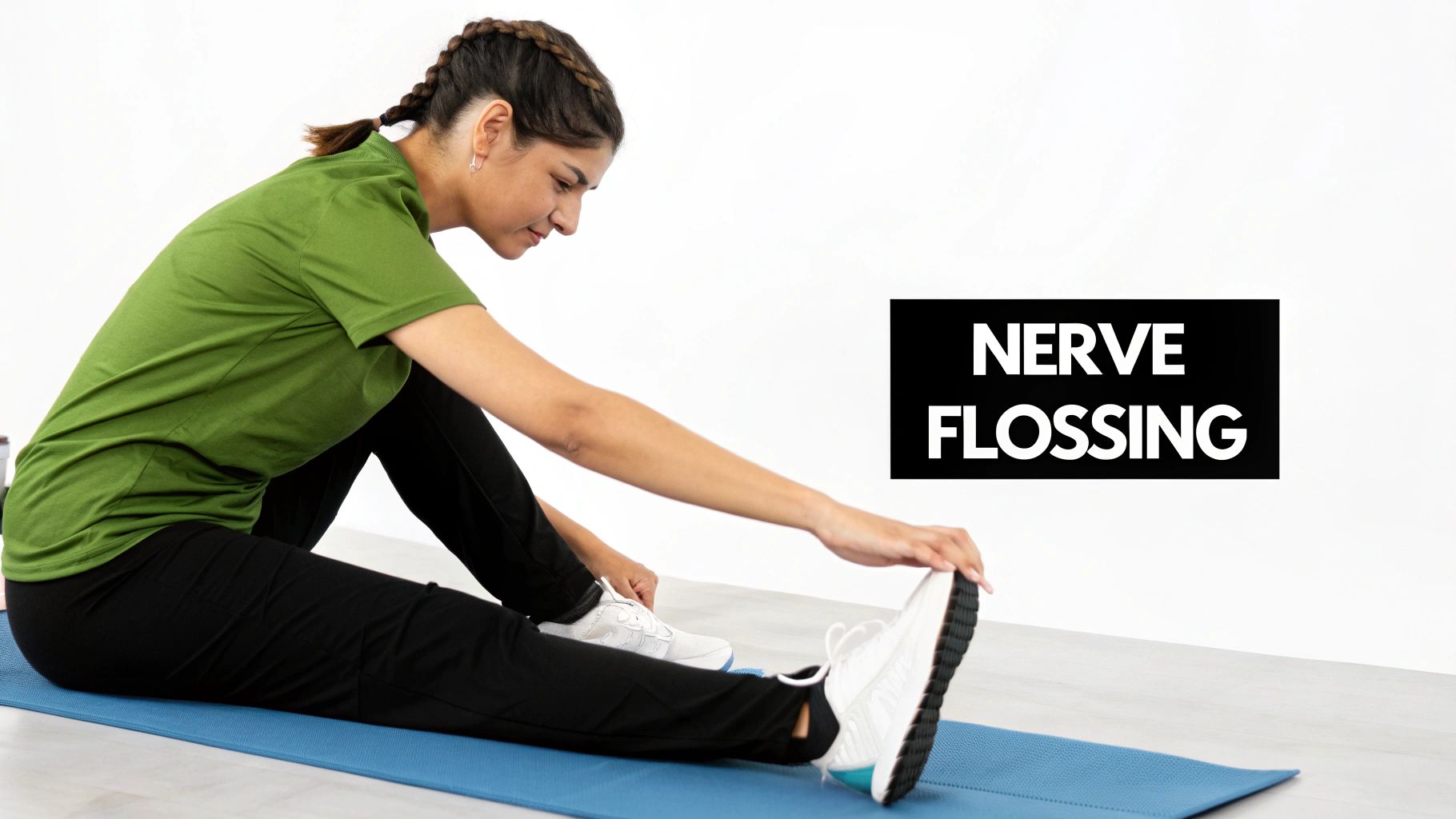 A woman on a yoga mat performing nerve flossing stretch, reaching for her foot.