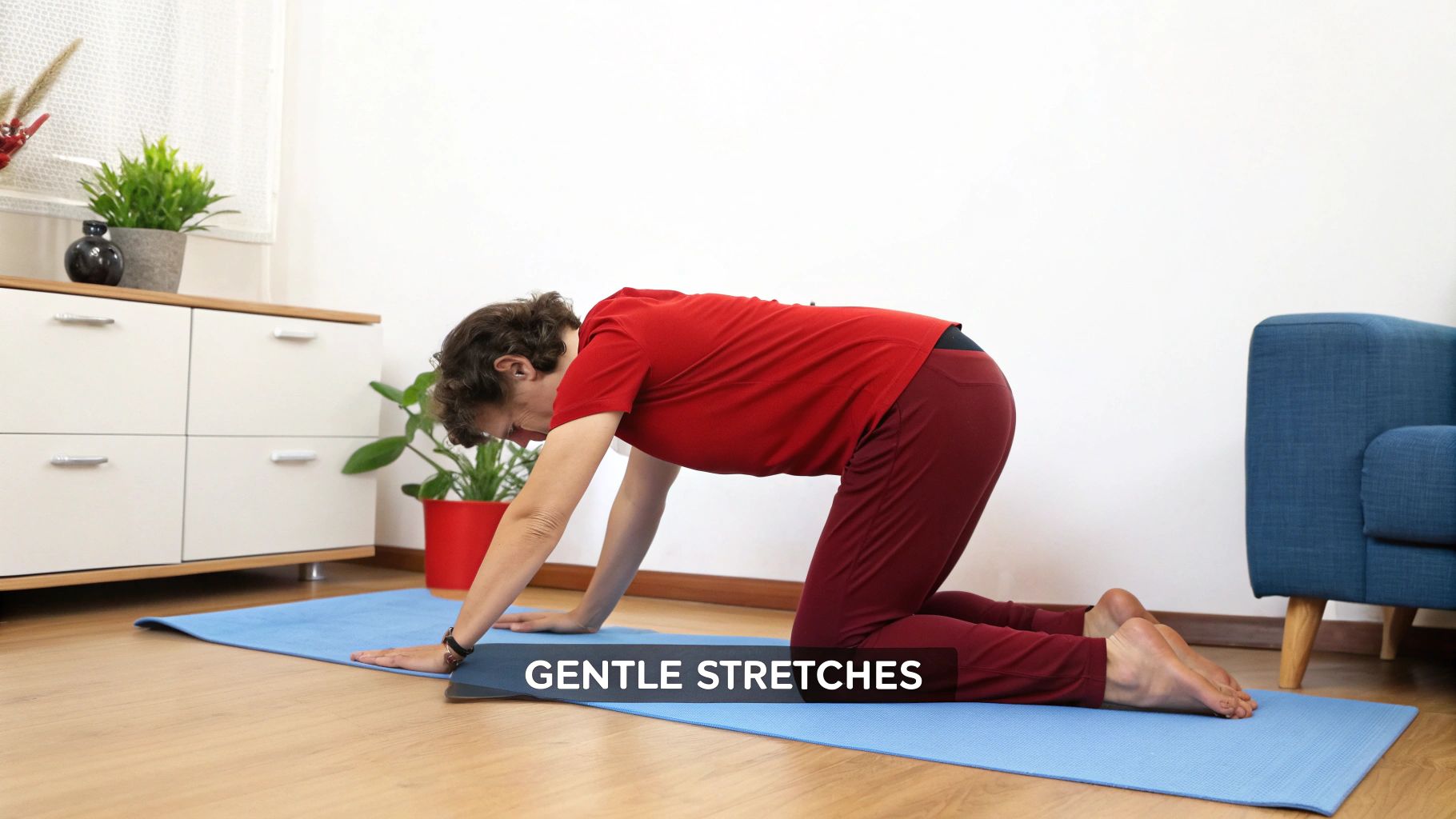 Person performing a gentle back stretch on a yoga mat to relieve lower back pain.