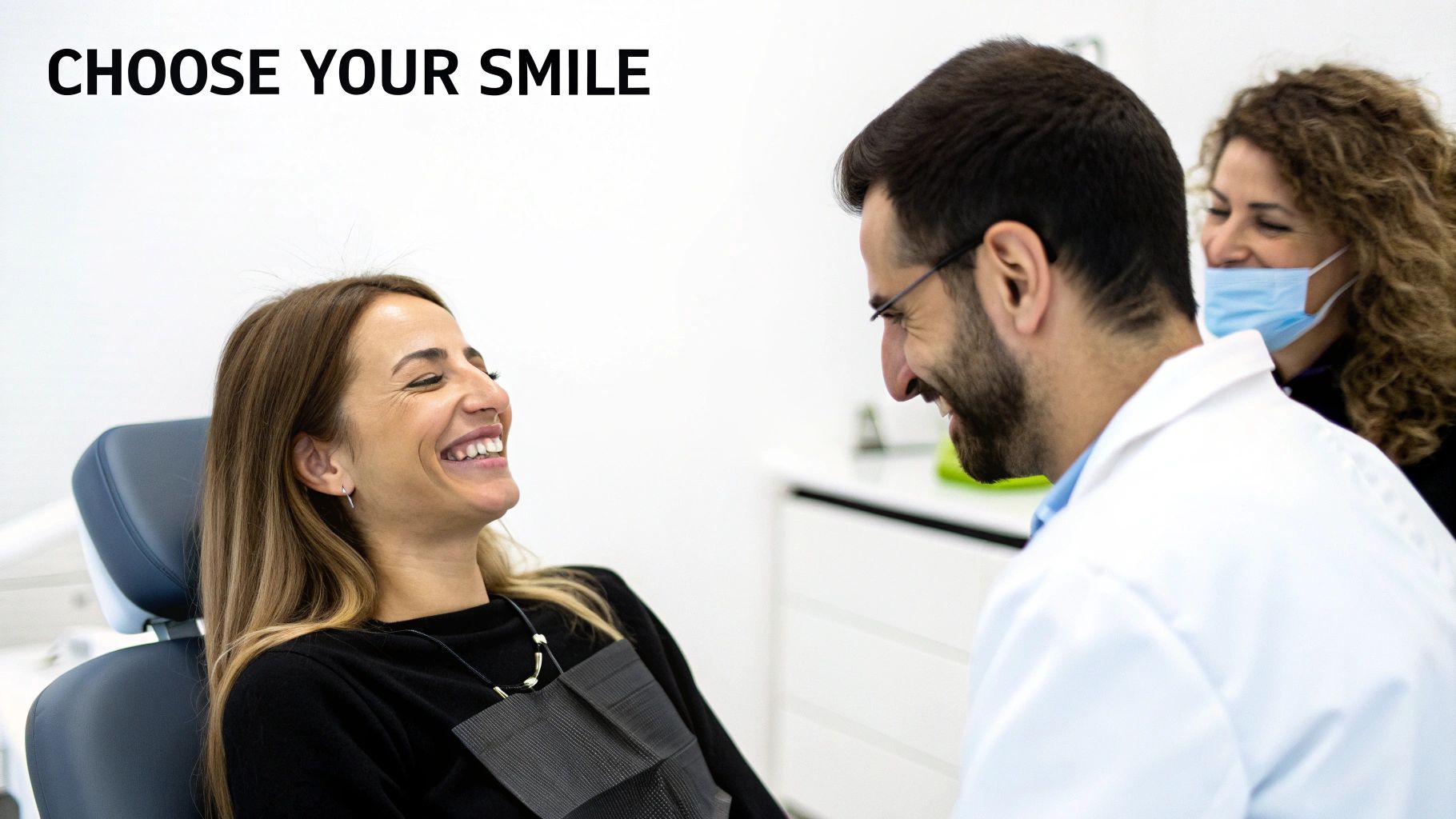 A happy patient smiles in a dental chair, interacting with a cheerful male dentist during a consultation.