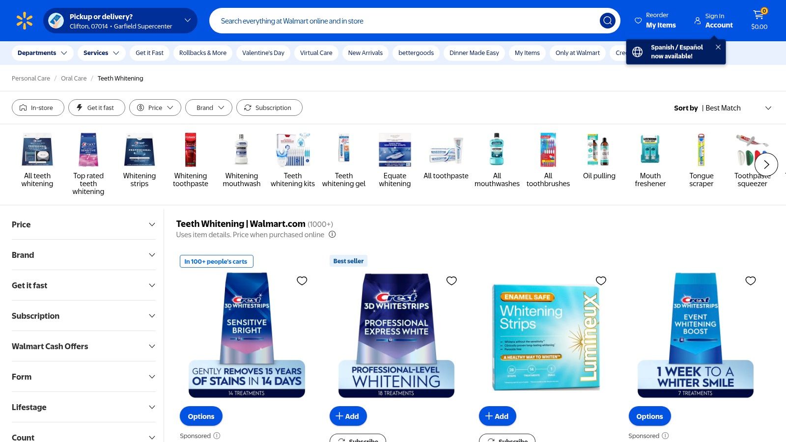 A person using a teeth whitening pen, a common product found at Walmart.