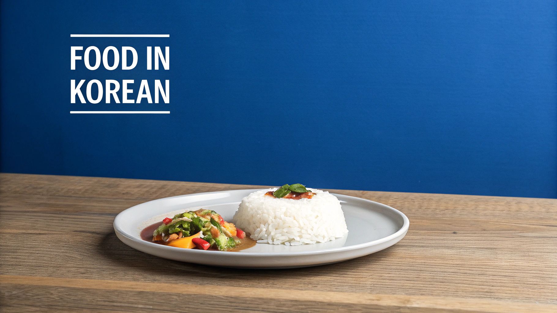 A plate with a mound of white rice and a colorful side dish of vegetables, possibly a Korean meal.