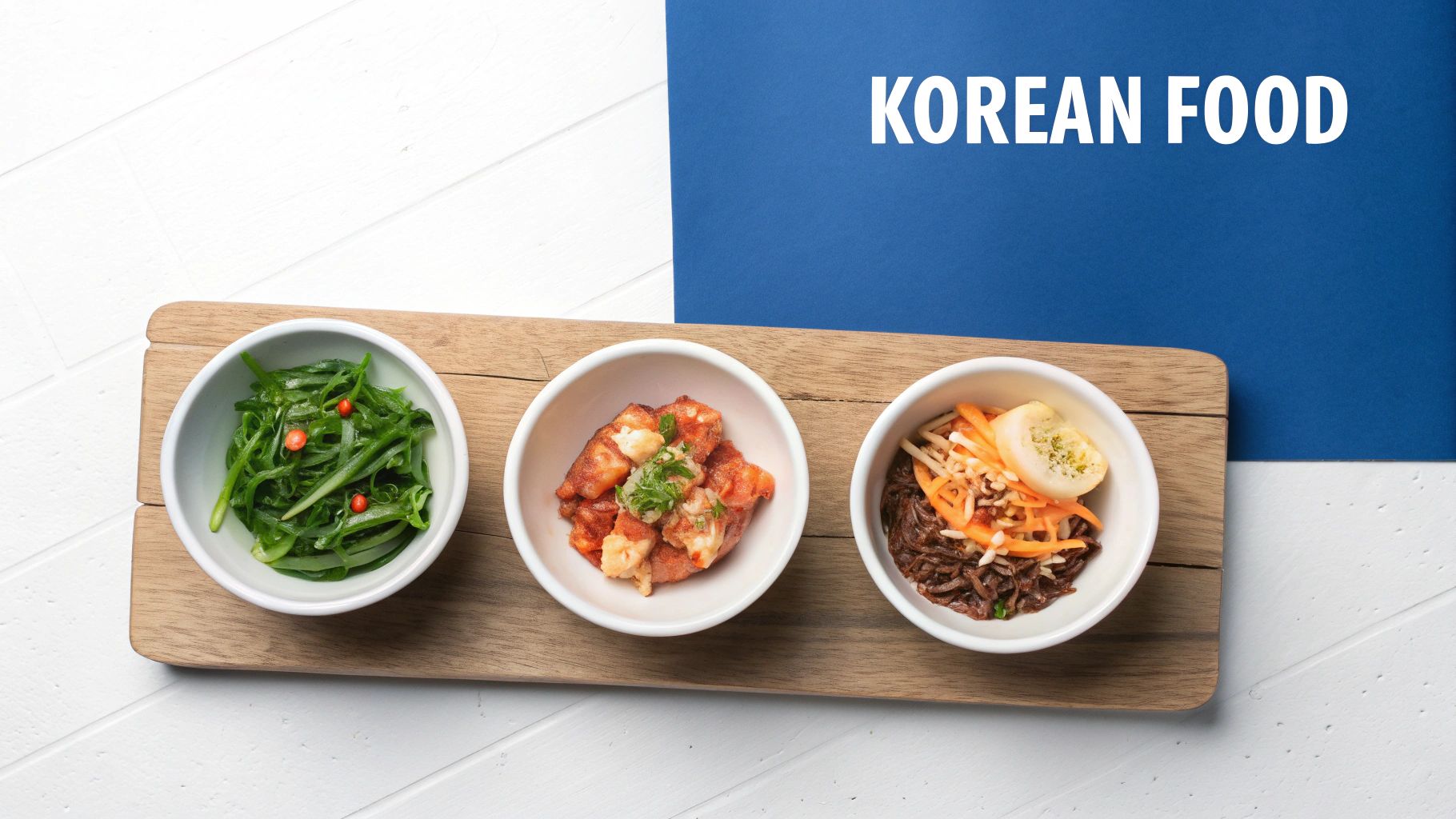 Three white bowls of traditional Korean side dishes served on wooden cutting board