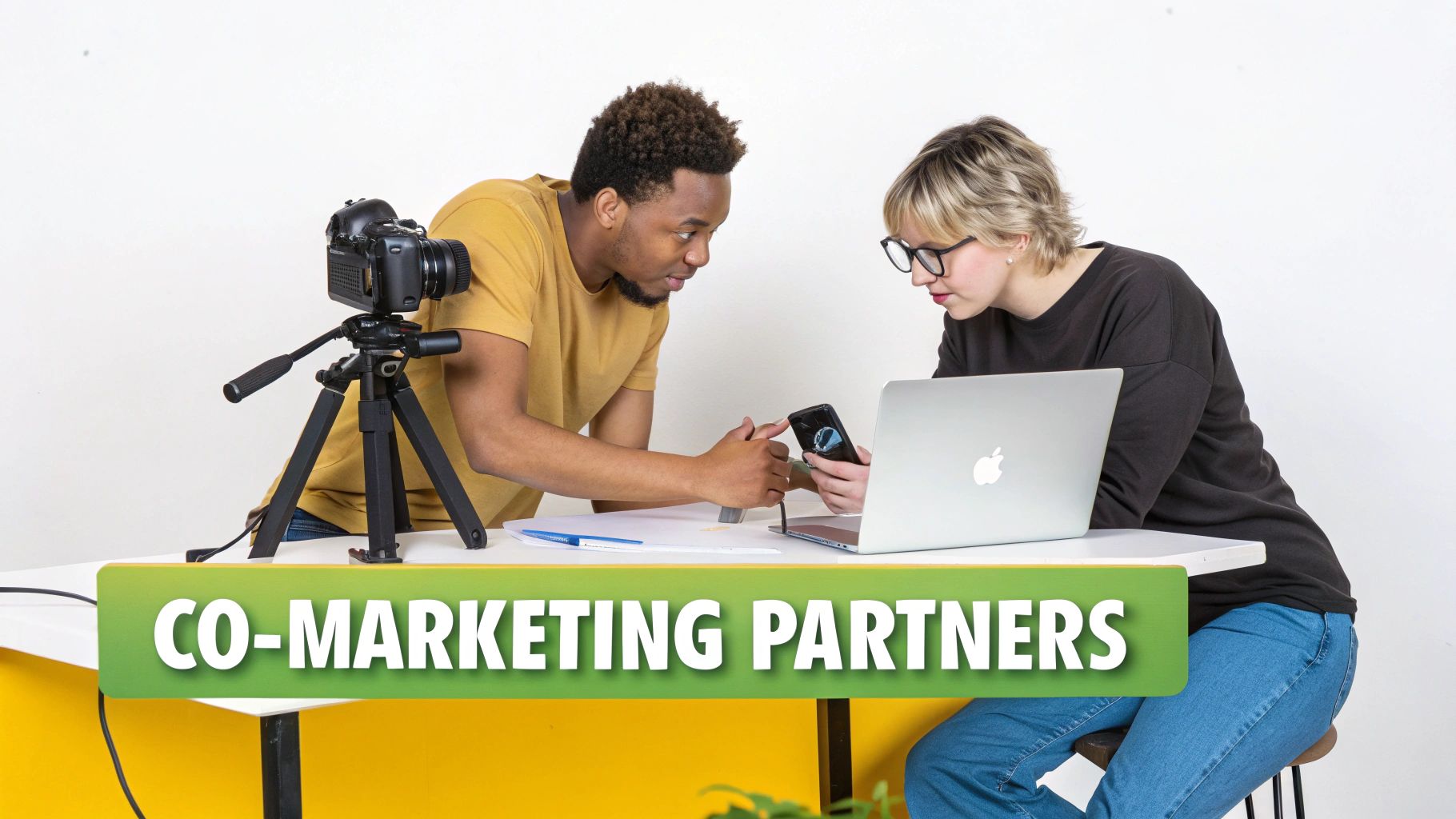 Two co-marketing partners collaboratively reviewing content on a smartphone and laptop, with a camera set up.