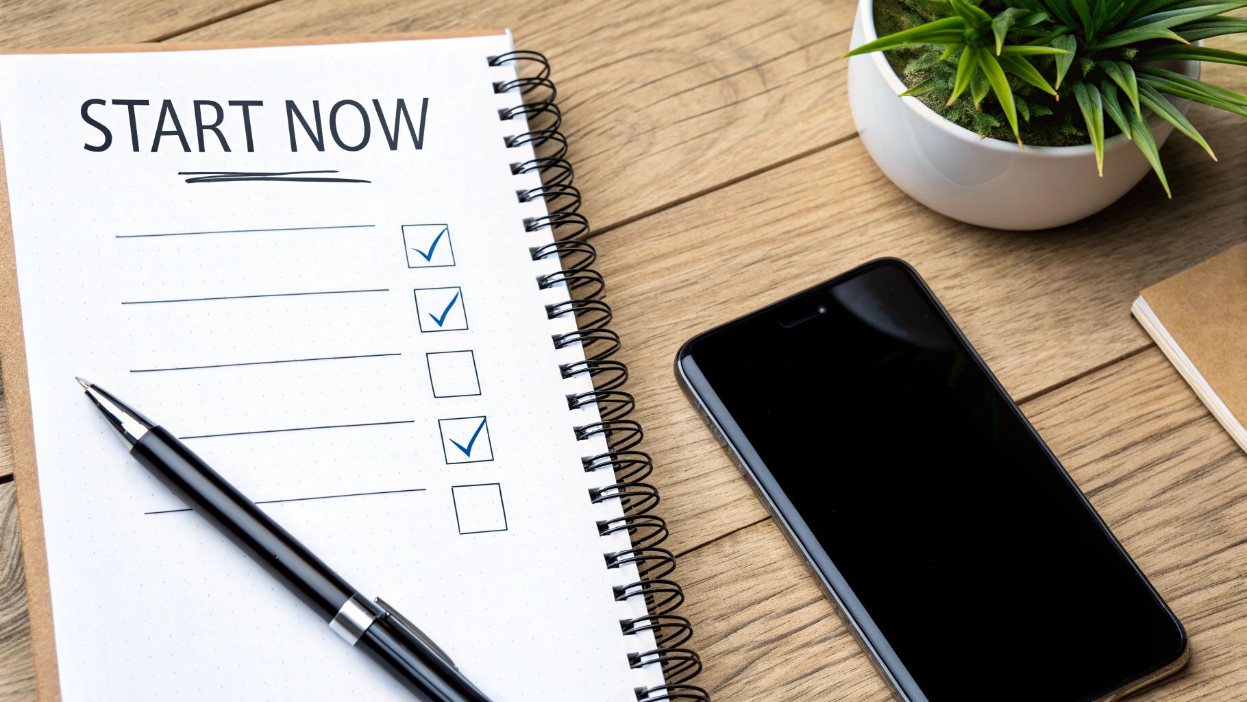 A person at a desk sketching out a marketing campaign, with sticky notes for audience, offer, and CTA.
