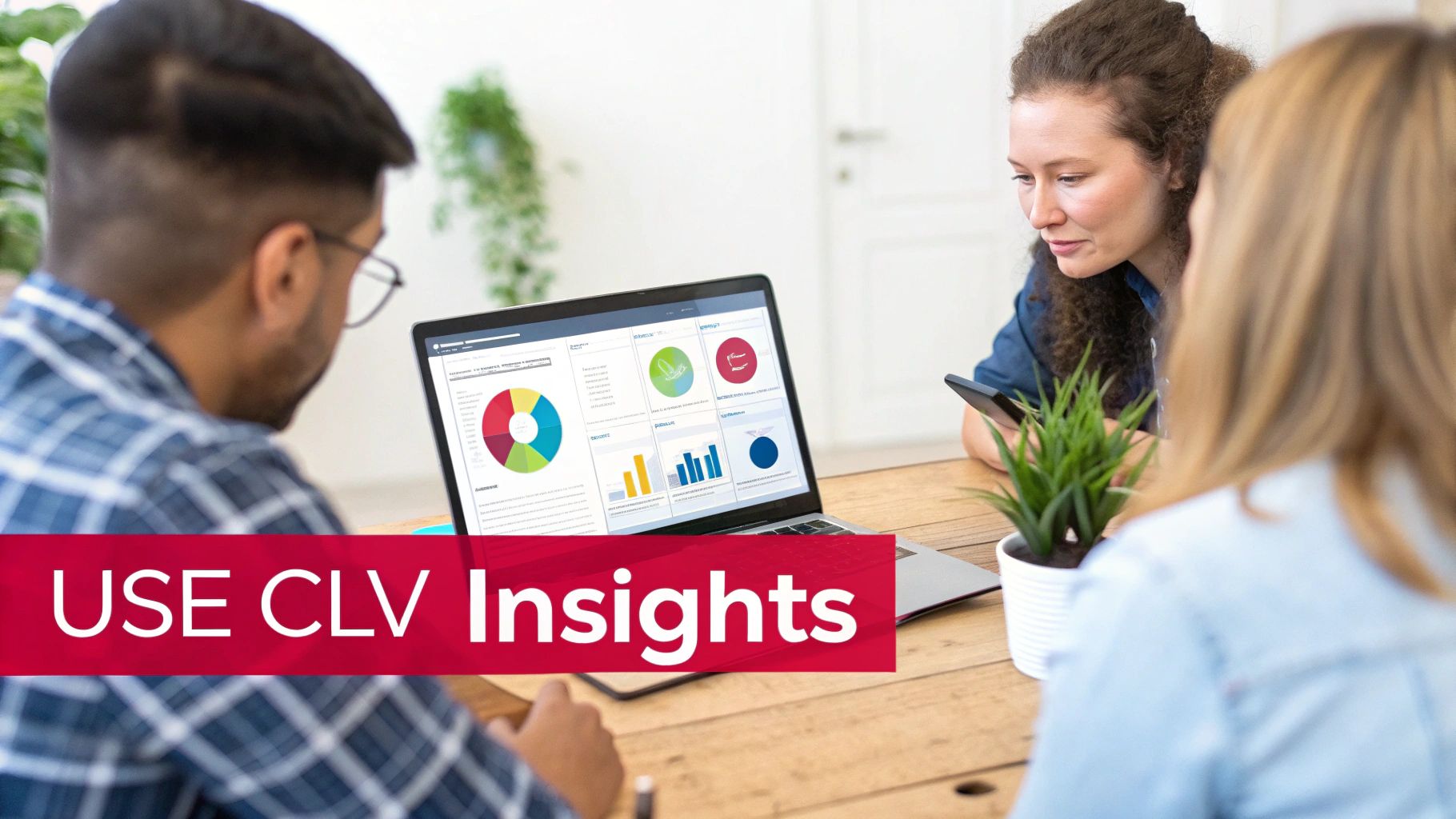 Three professionals analyzing customer lifetime value insights on a laptop with charts and graphs.