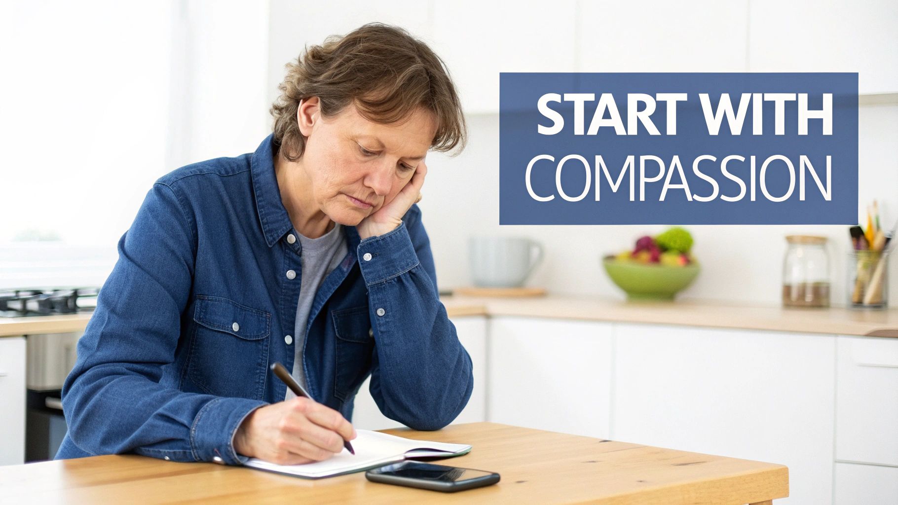 A pensive woman writing in a notebook at a kitchen table, with a blue 'START WITH COMPASSION' overlay.