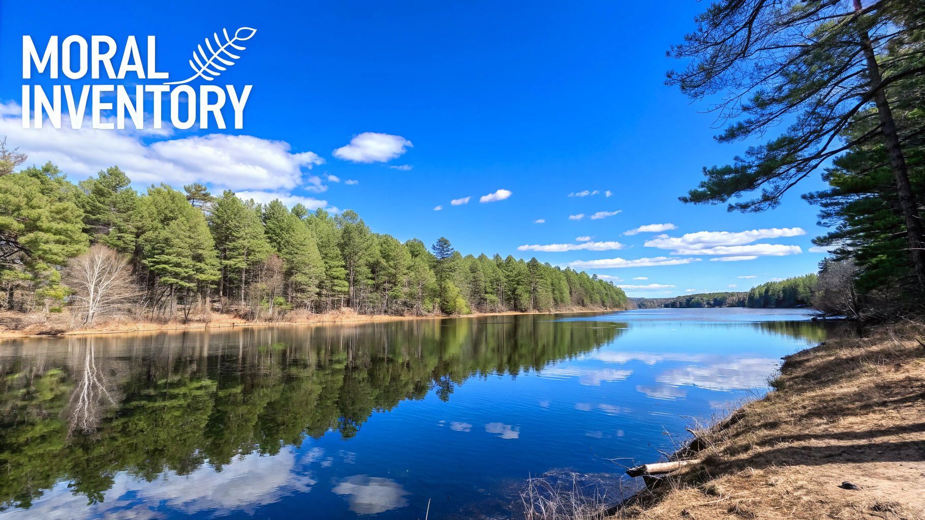 Three smooth stones stacked perfectly on a serene beach, symbolizing balance and the foundational principles of honesty, hope, and faith.