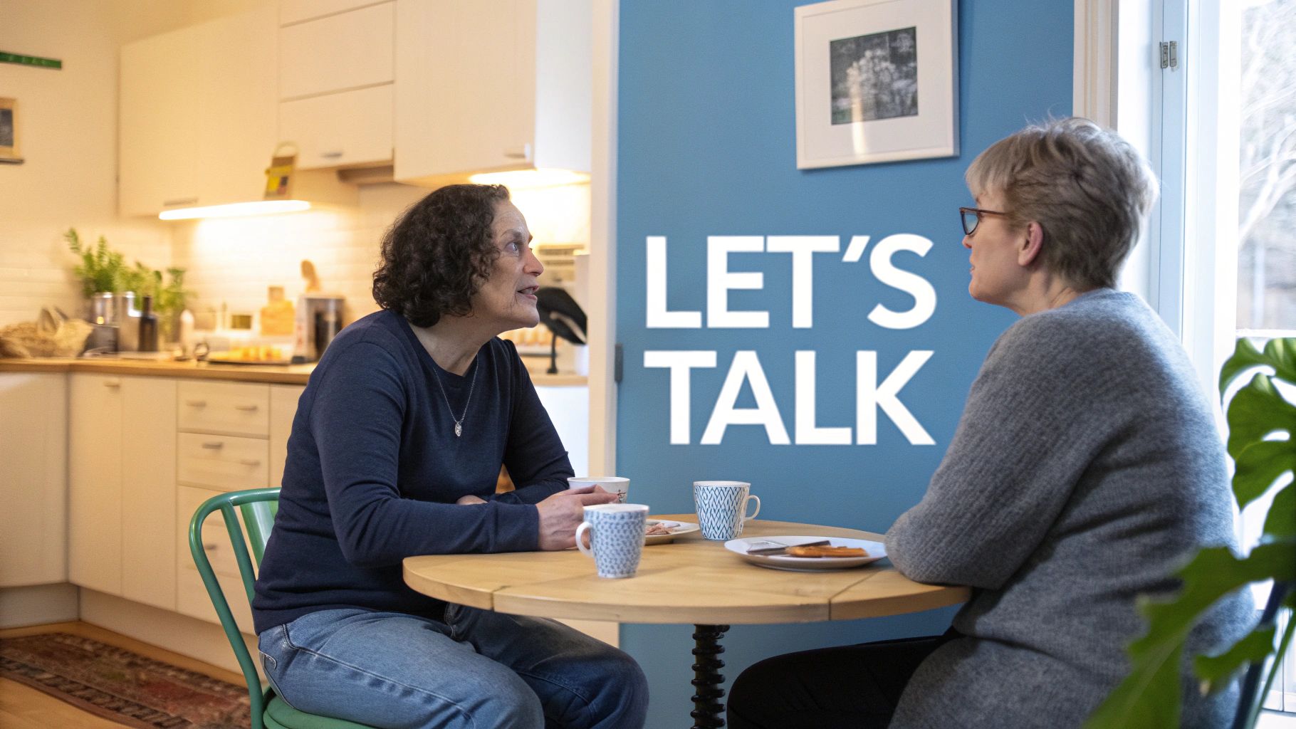Two people having a serious but calm conversation at a kitchen table.
