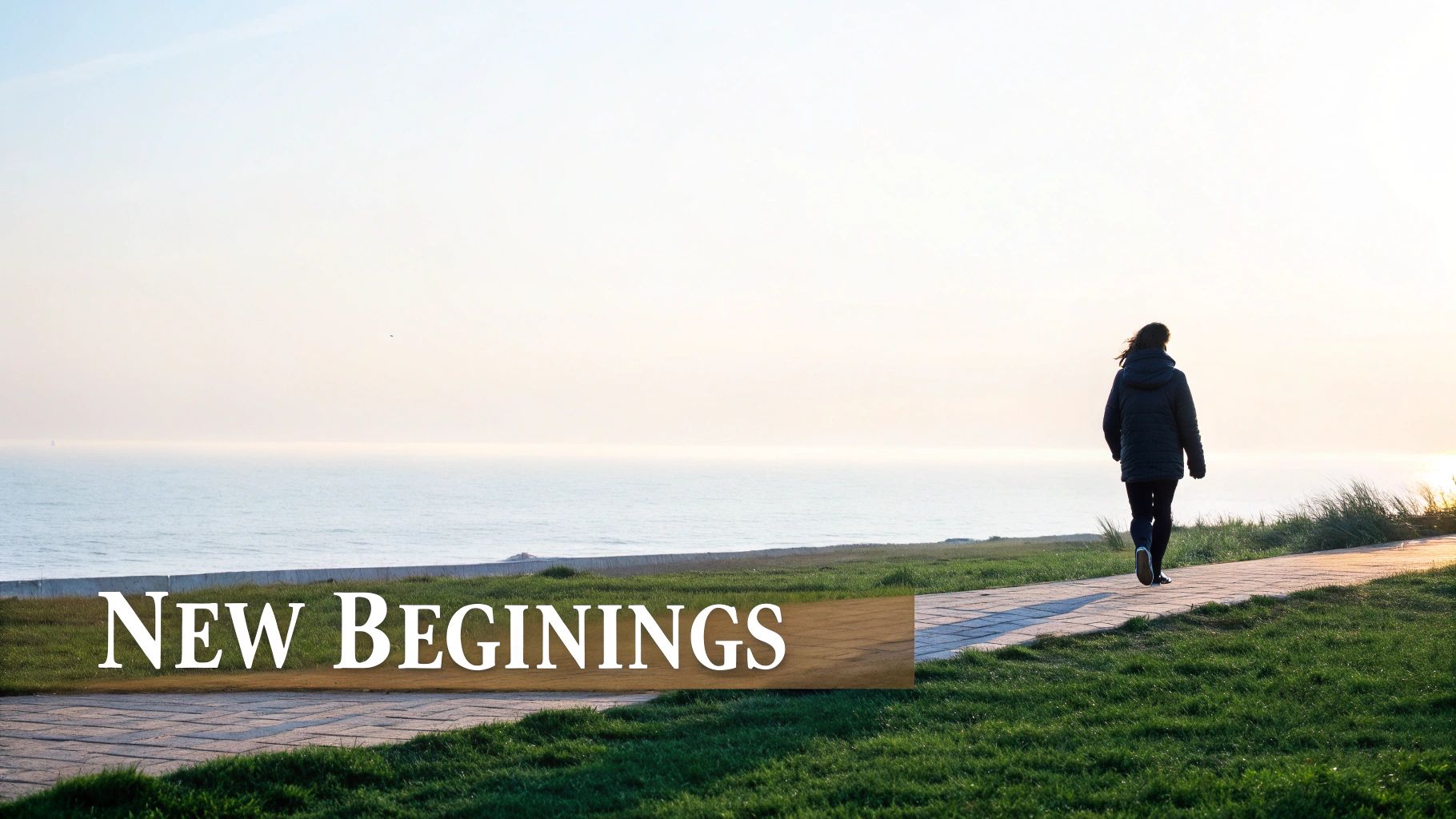 A person walks along a scenic coastal path towards a bright horizon, symbolizing new beginnings.