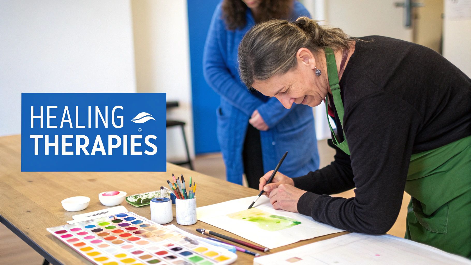 Two people sitting and talking in a therapy session