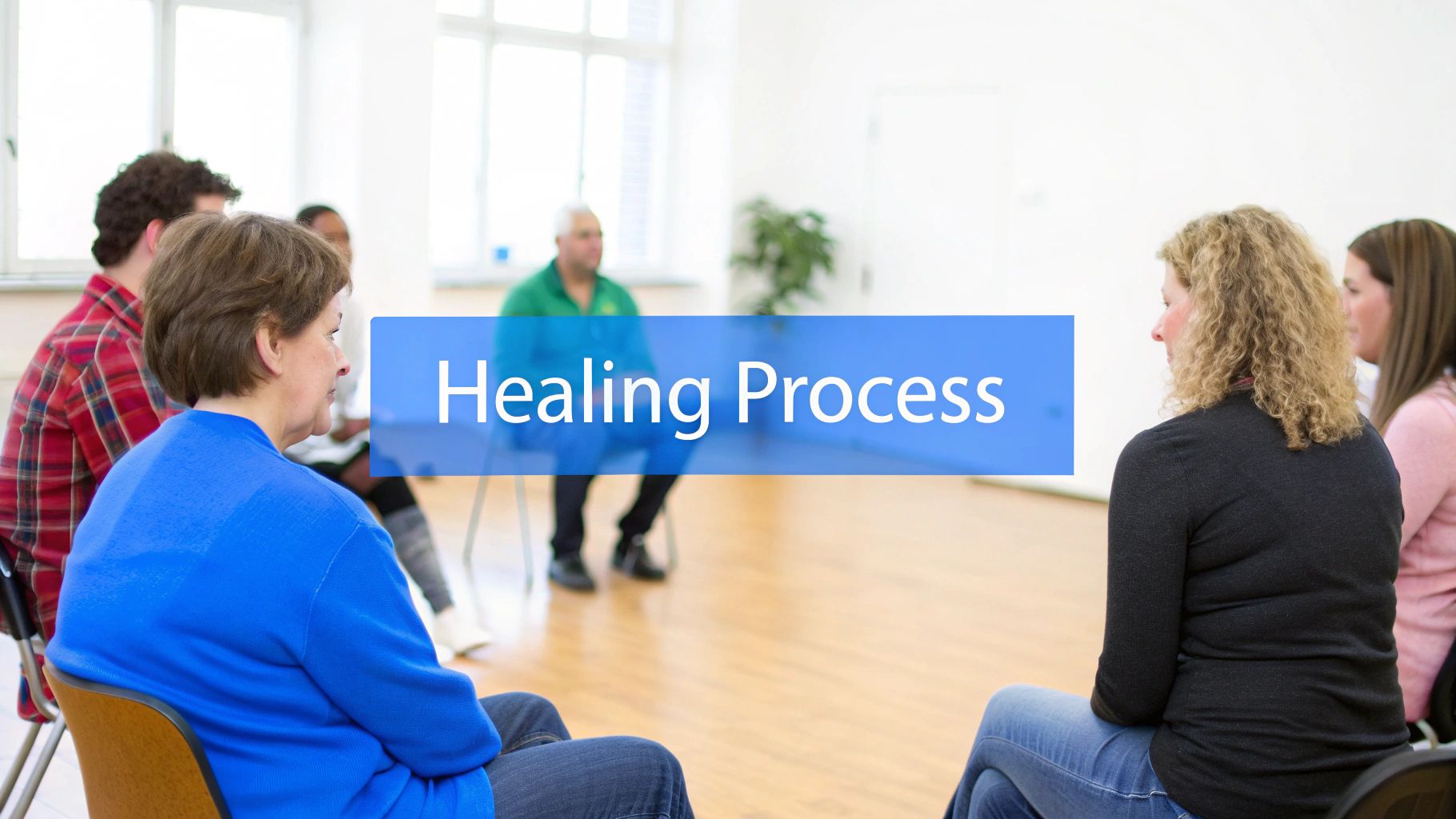 A person looking out over a calm lake at sunrise, symbolizing a new beginning.