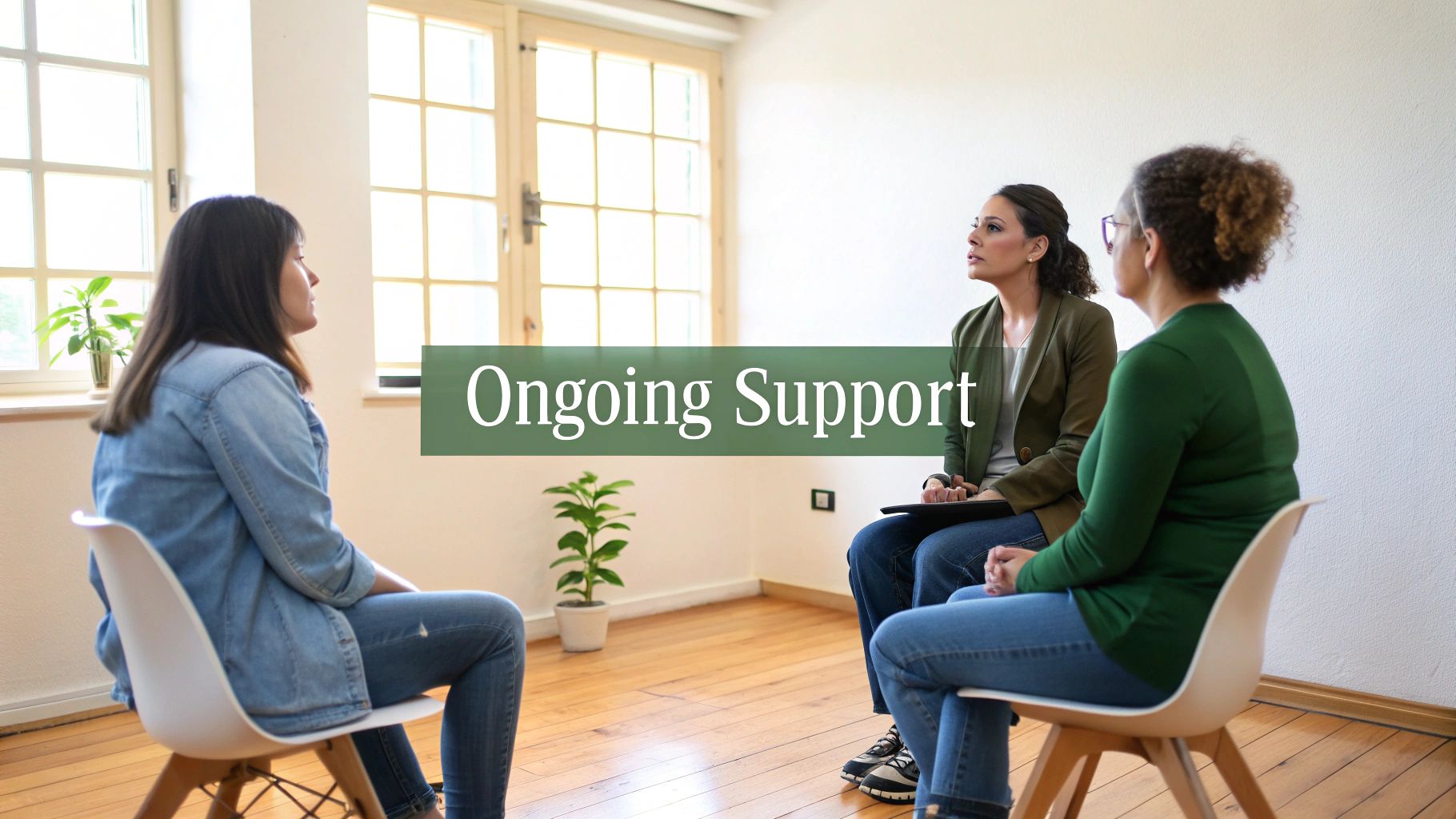 Three women engaged in a group therapy session, receiving ongoing support and discussion.