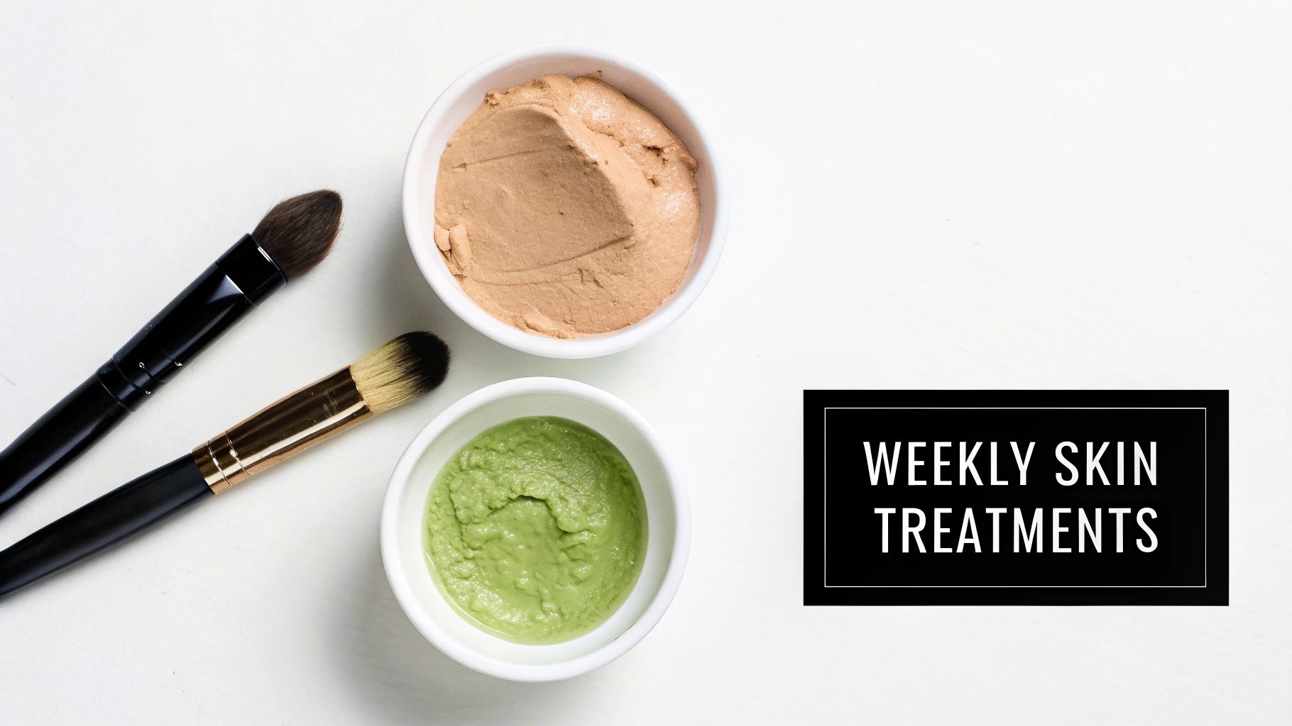 Overhead view of two bowls with green and brown face masks and two makeup brushes.