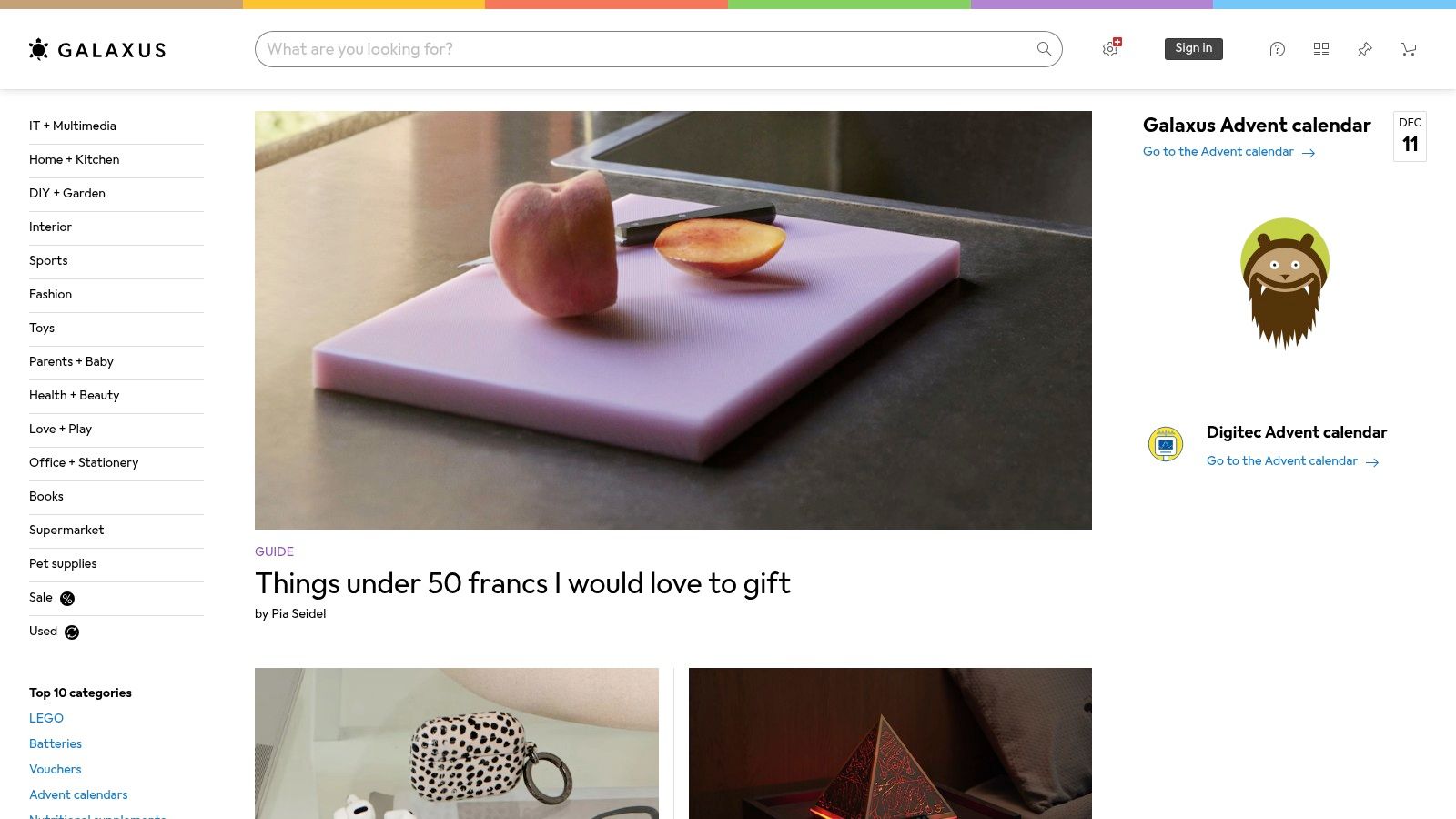Eine Person wählt auf einer rosafarbenen Schneidematte Fitnesszubehör aus, was das vielfältige Sortiment von Galaxus symbolisiert.