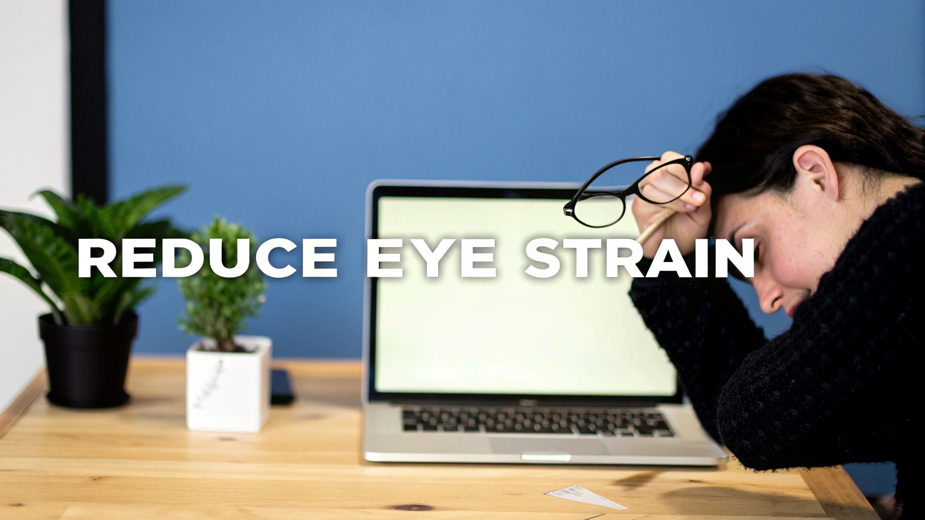 Woman holding glasses, looking tired at her desk with a laptop, text says 'REDUCE EYE STRAIN'.
