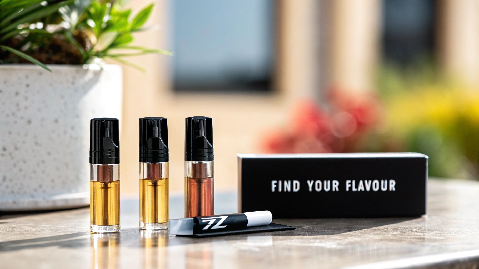 Three Z Pods with golden liquid, a 'FIND YOUR FLAVOUR' box, and a 7Z pen on a table.