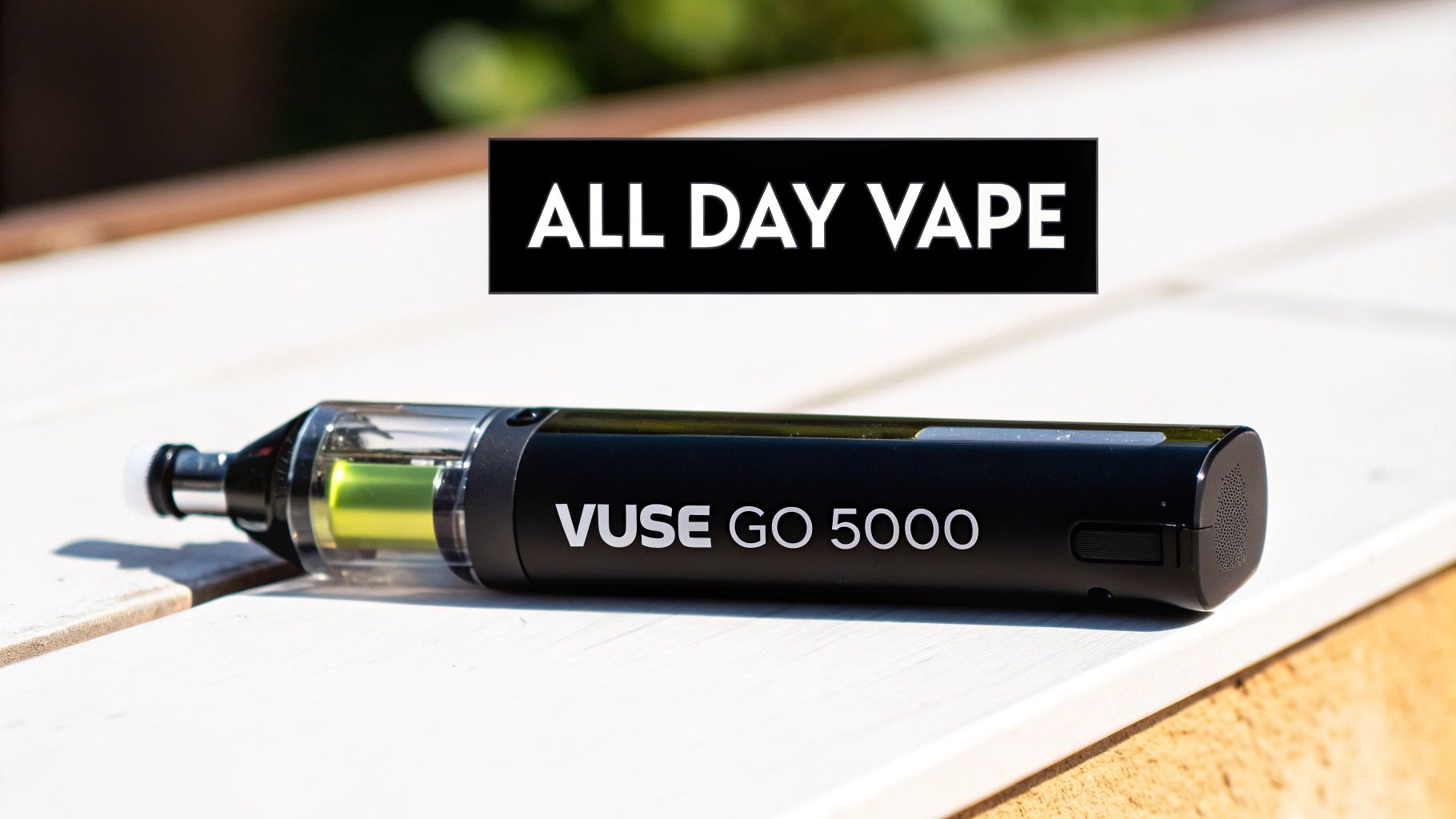 A black Vuse Go 5000 vape device with a clear tank and green liquid, labeled 'ALL DAY VAPE'.