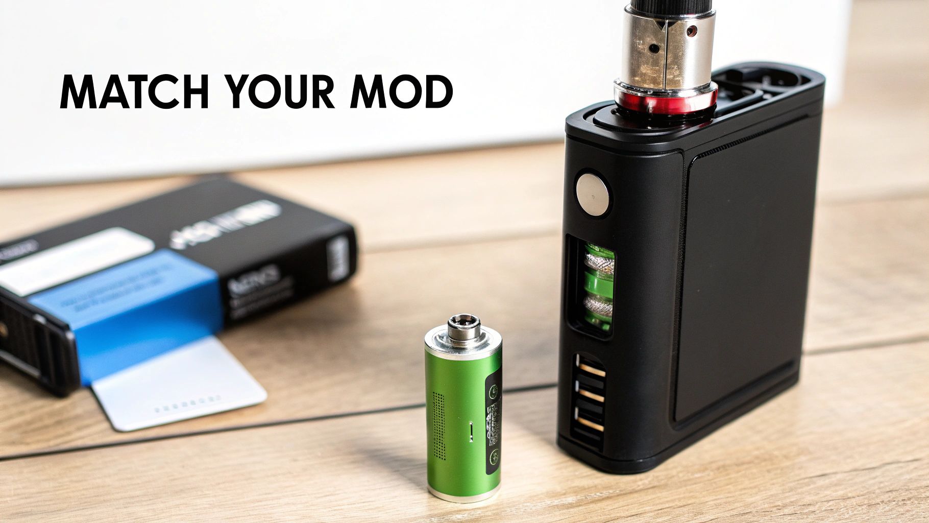 Black vape mod displaying internal green 18650 batteries, with another battery for matching.