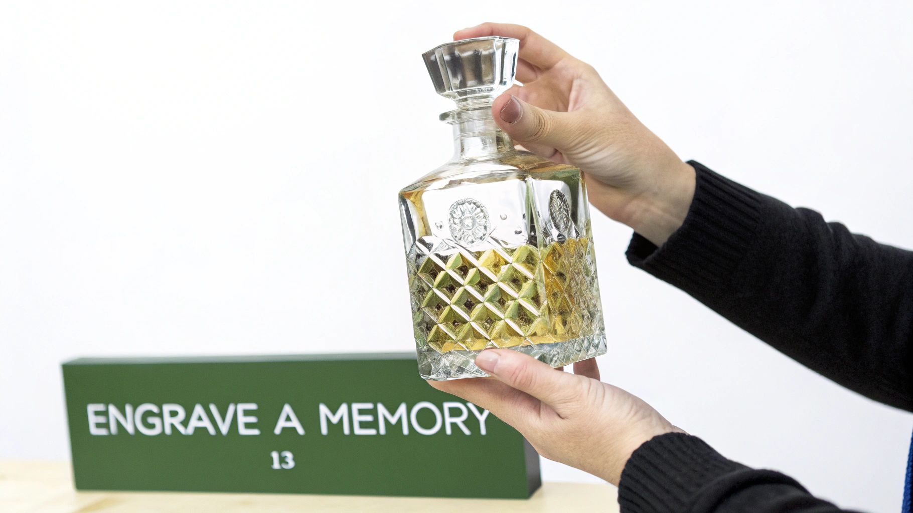 A personalized whiskey decanter and glass set with custom engravings.