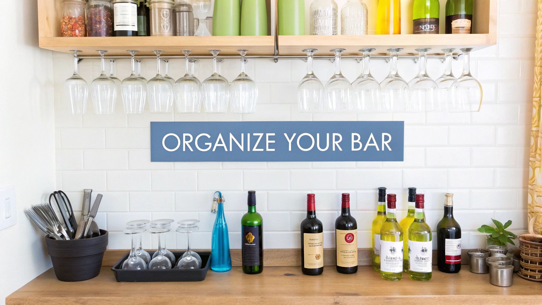 An organized home bar featuring wine bottles, hanging glasses, and bar tools on a wooden counter.