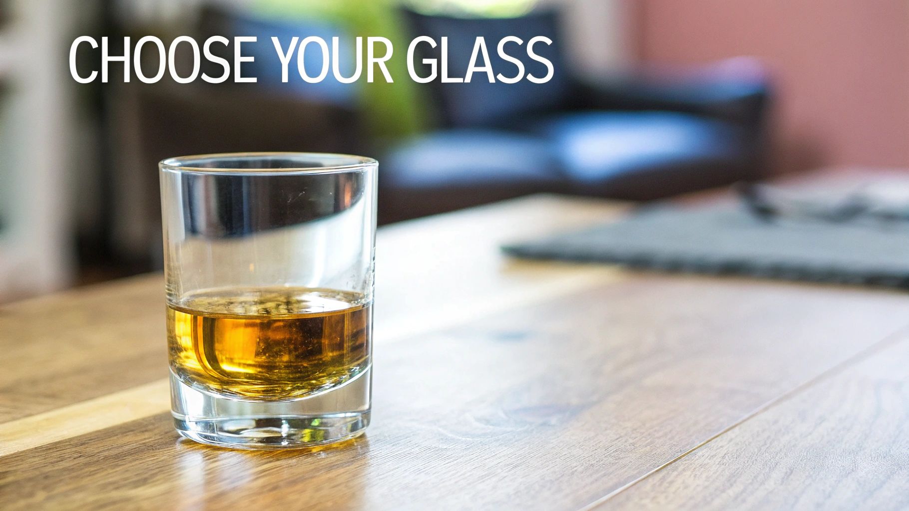 A glass of golden whiskey sits on a wooden table, inviting you to choose your perfect glass.