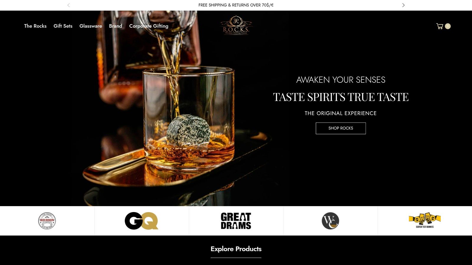 ROCKS Whiskey Chilling Stones gift set with two glasses, chilling stones, tongs, and a velvet pouch in a wooden box