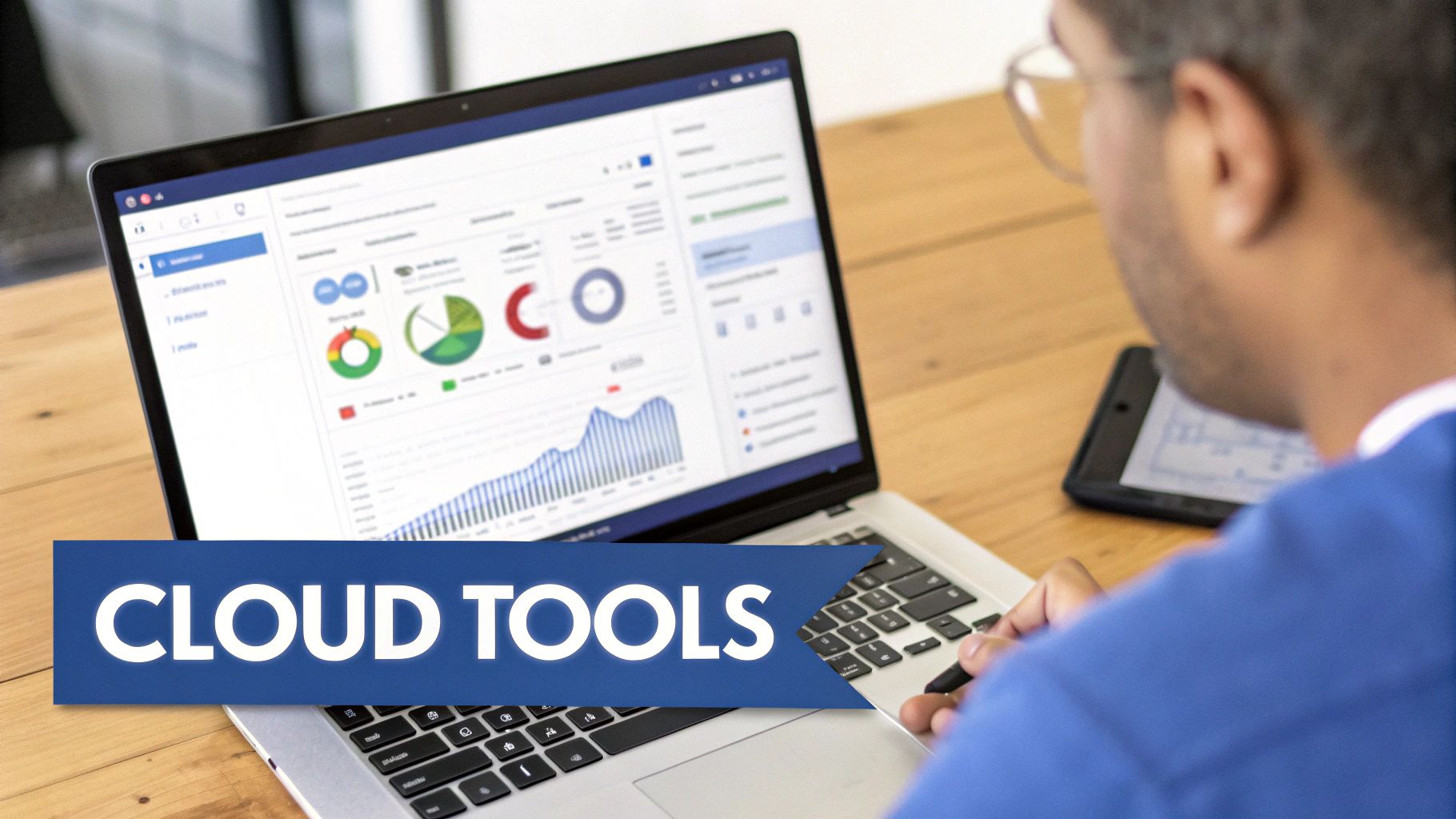 Person using a laptop displaying data analytics charts and graphs, with a 'CLOUD TOOLS' banner.