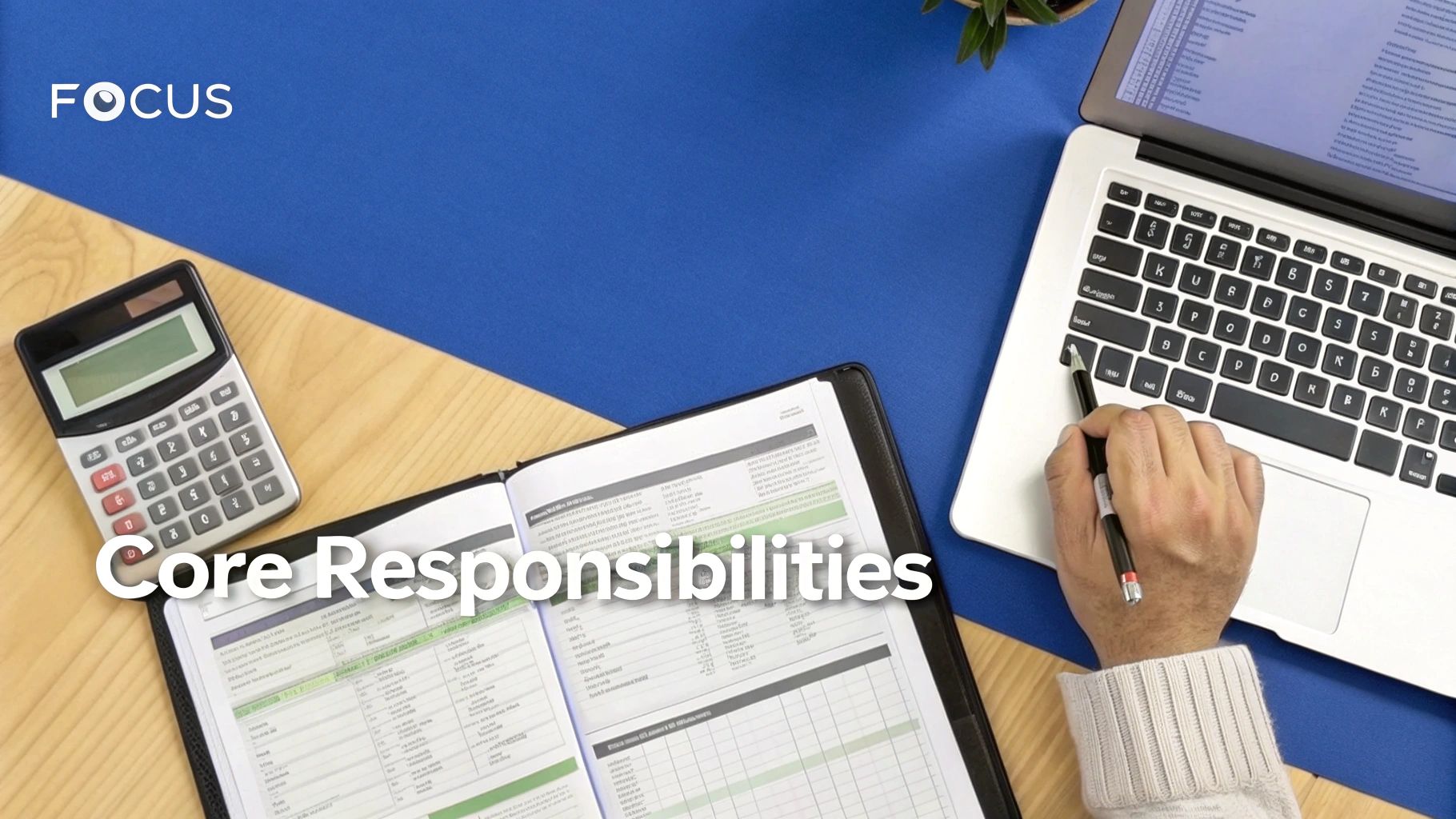 A person at a desk reviewing complex financial reports and charts on a monitor, symbolizing FinOp responsibilities.