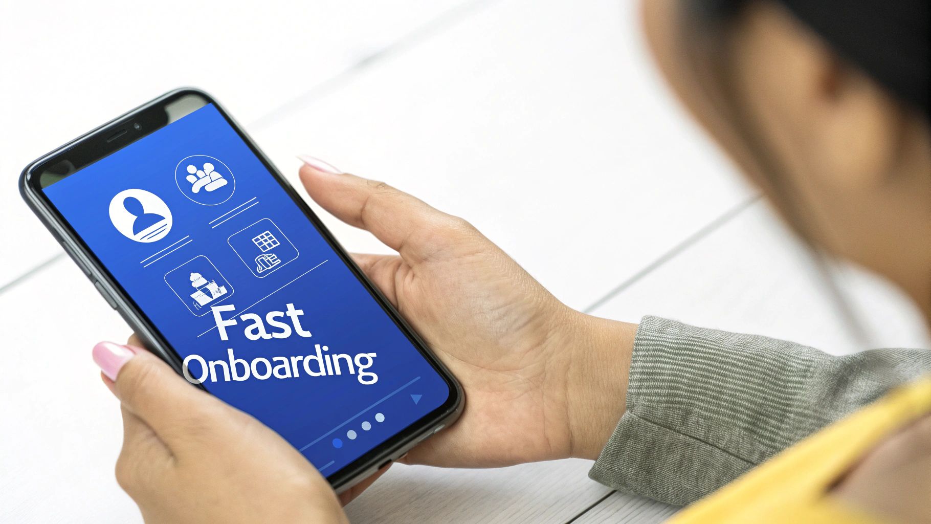 Person using smartphone displaying fast onboarding app with user profile and group icons on blue screen