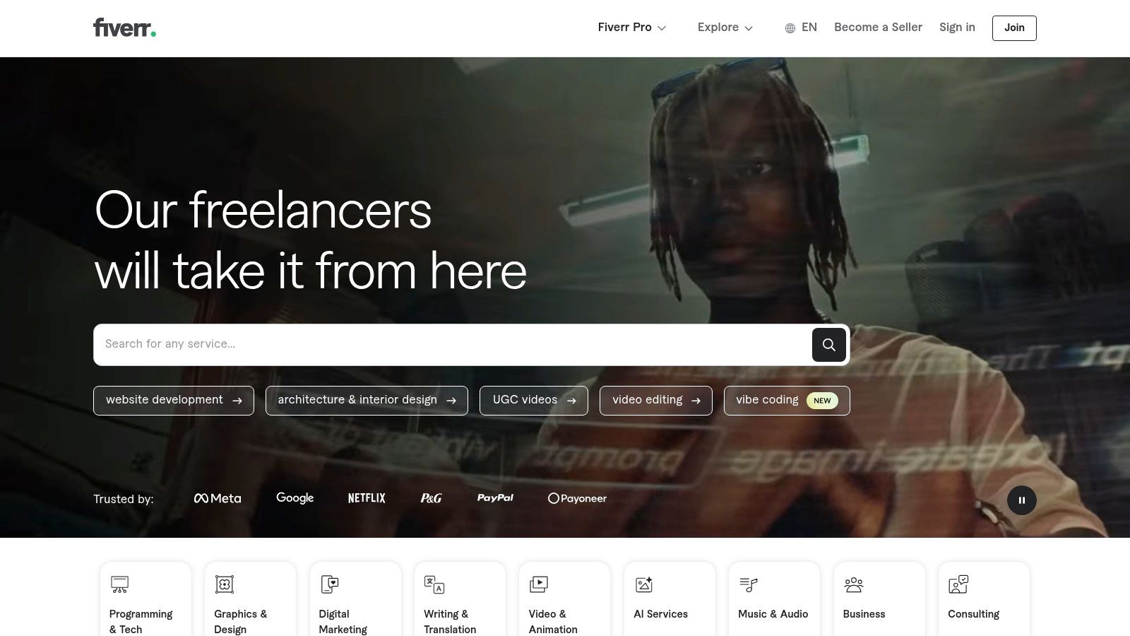 A screenshot of the Fiverr website homepage, showcasing various service categories and featured freelancers.
