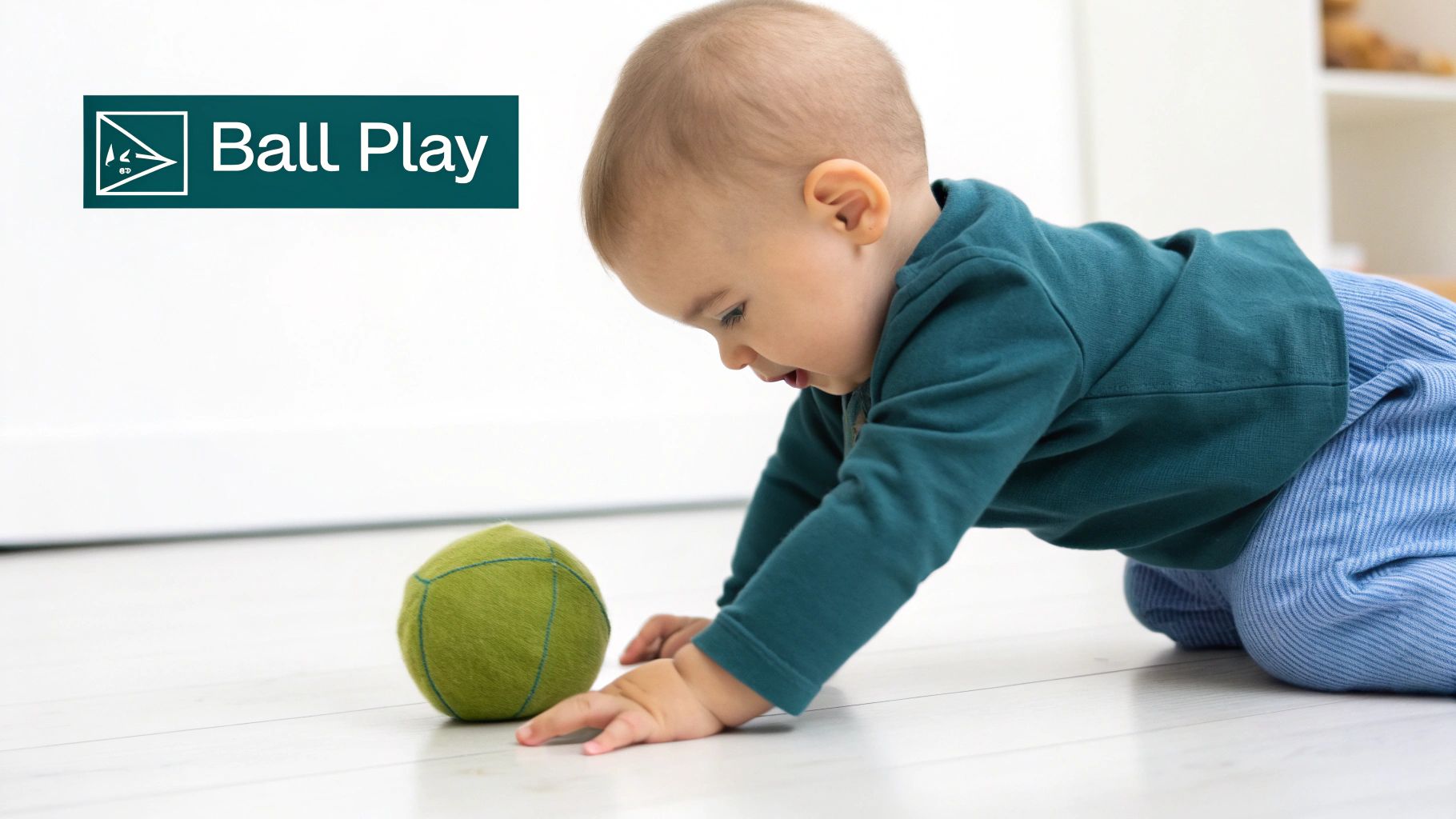 An adorable baby on hands and knees reaching for a soft green ball, promoting motor skills.