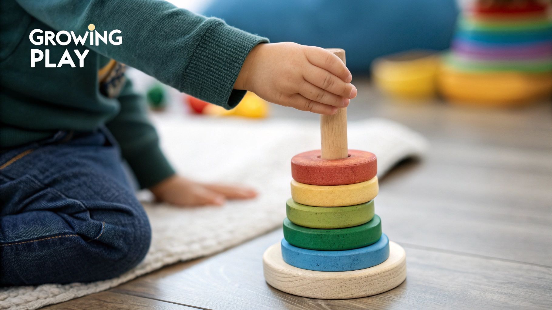 A child plays with stacking rings, a toy that can grow with them.
