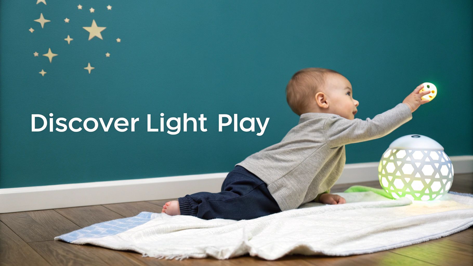 A baby on a blanket reaches for a small glowing light toy next to a larger sensory light, with text "Discover Light Play" on the wall.