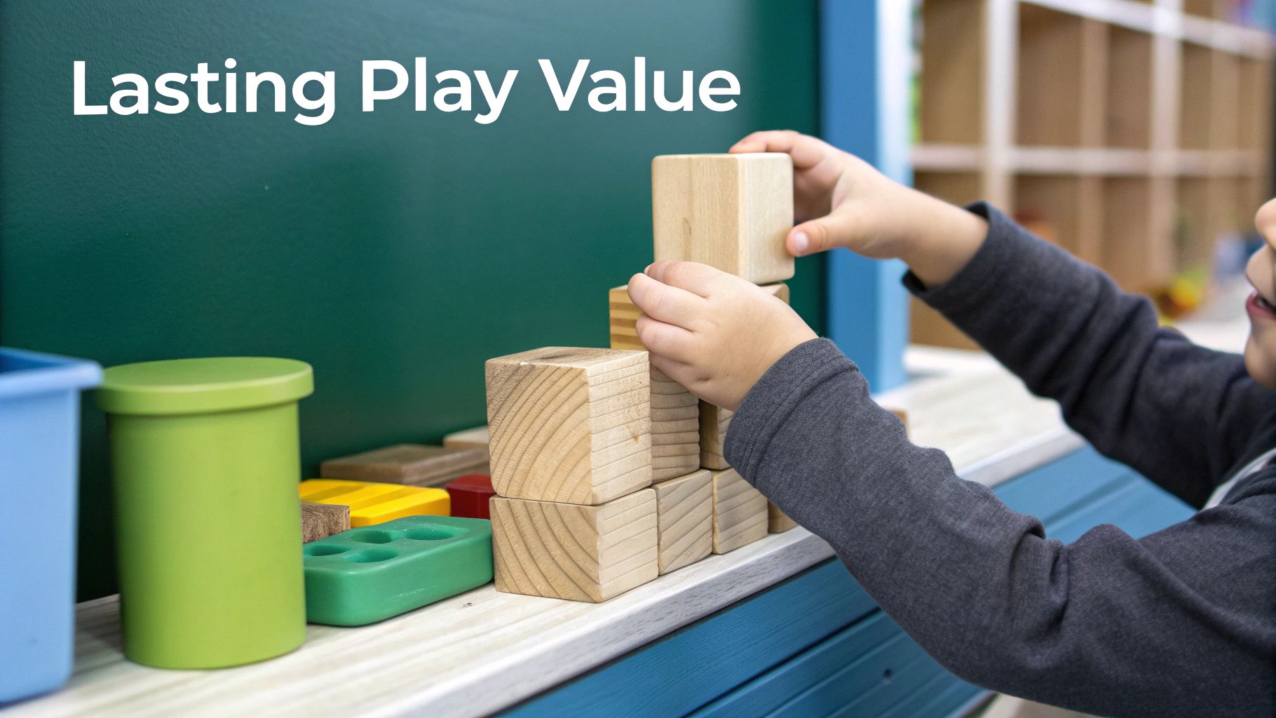 A child's hands playing with colourful, high-quality wooden building blocks on a wooden floor.