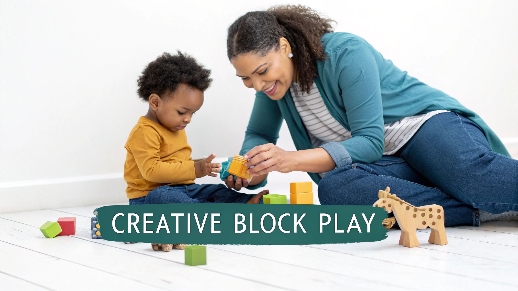 A smiling woman and a toddler joyfully play with colorful building blocks on a white floor.